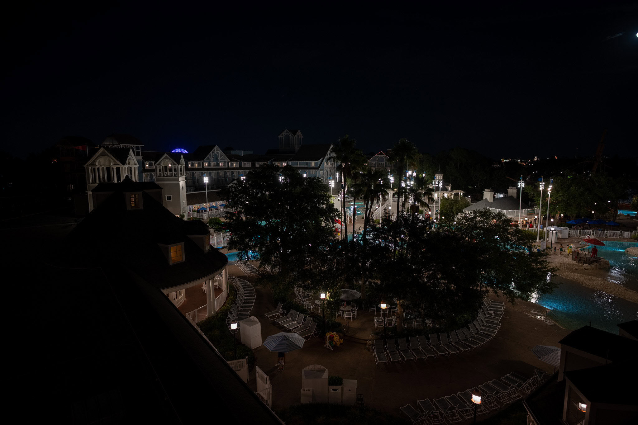 Disney’s Beach Club Resort at Night – View from DVC Villas Nighttime view of Disney’s Beach Club Resort, captured from the DVC Villas, with illuminated pools and resort buildings in the background.