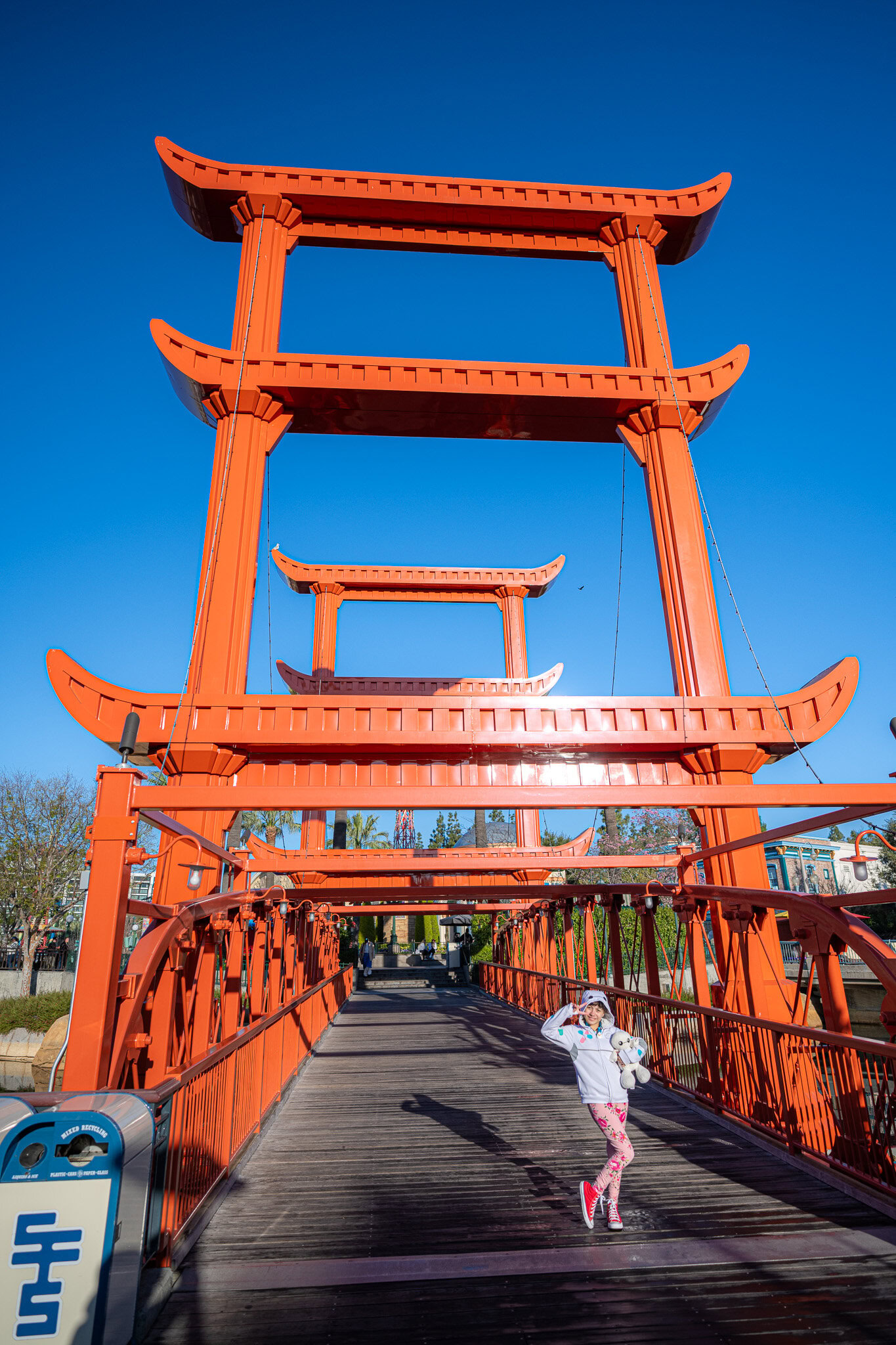Daniela posing under the red torii-style bridge at San Fransokyo Square.