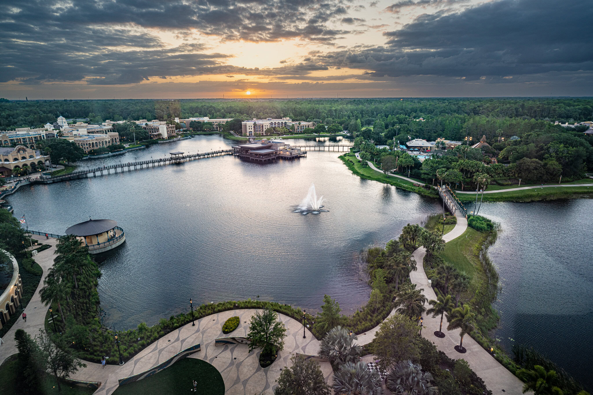 Aerial sunset view of Disney’s Coronado Springs Resort and lake, captured from Gran Destino Tower