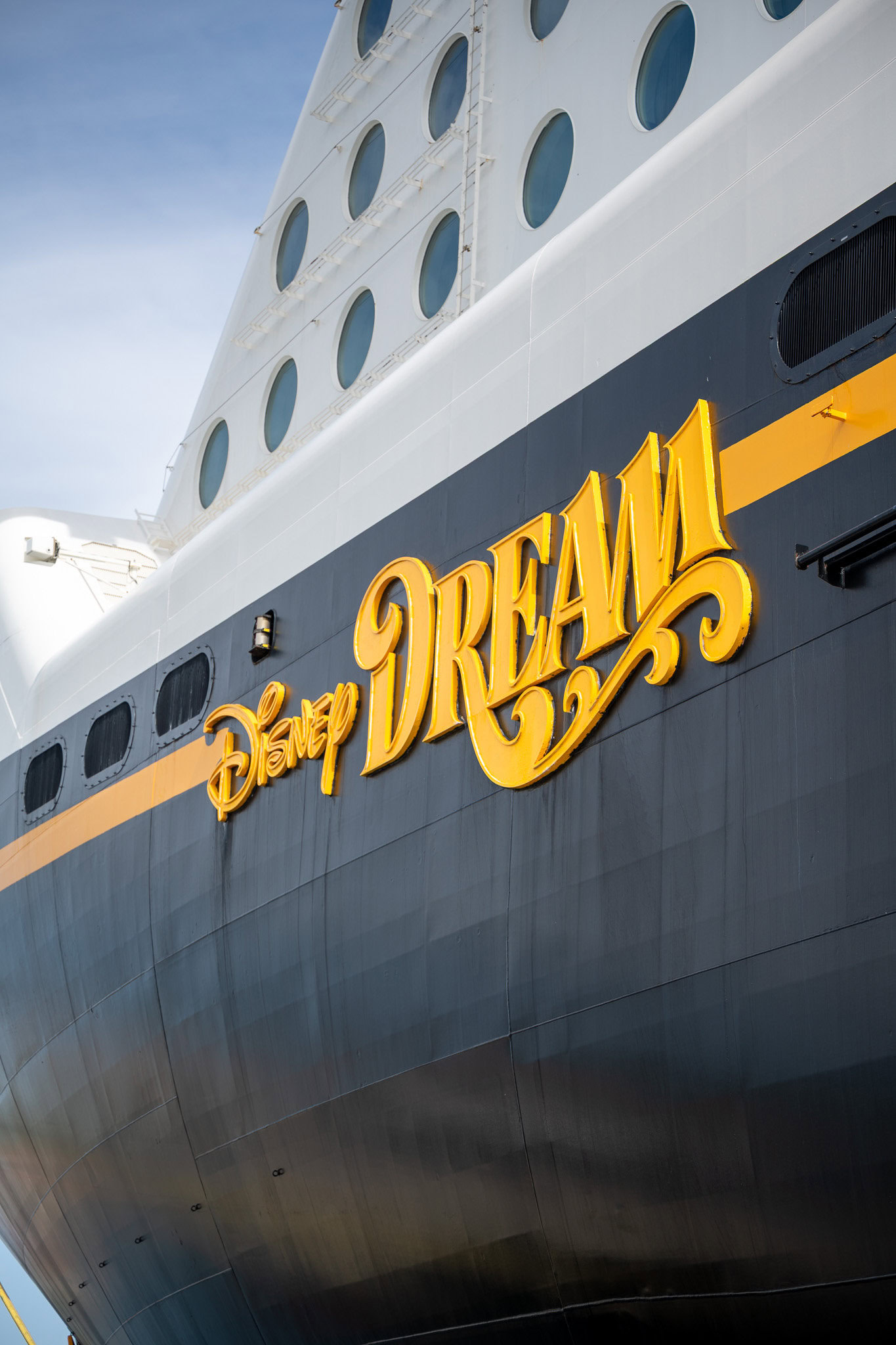 Disney Dream Cruise Ship – Signature Bow and Gold Lettering Disney Dream cruise ship bow with gold lettering and signature porthole design.