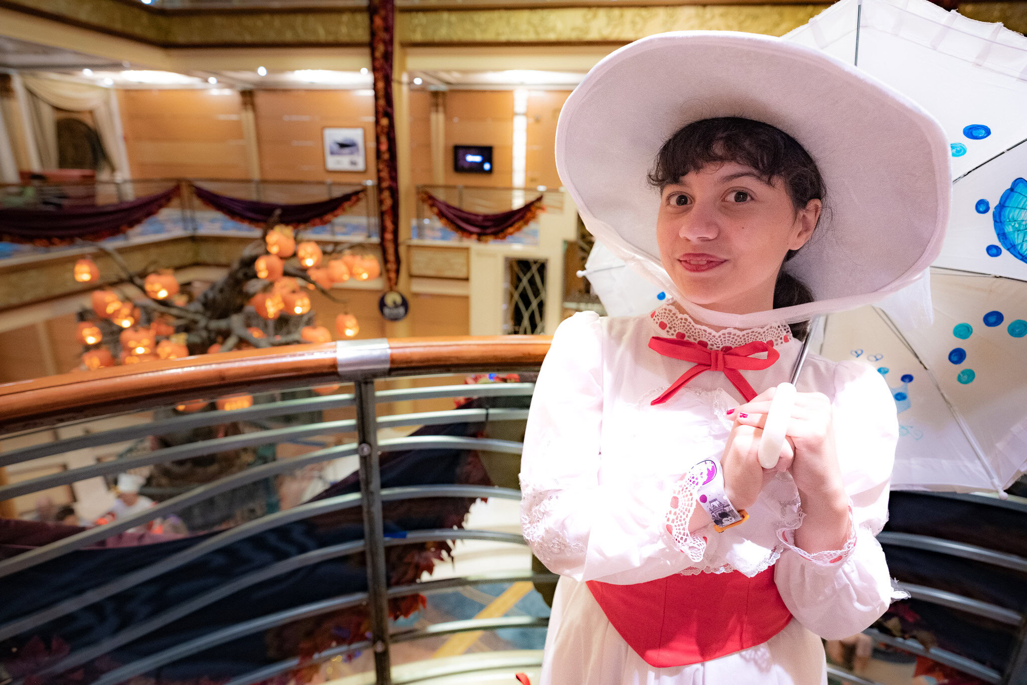 Daniela in a Mary Poppins costume with her umbrella on Disney Magic during Halloween on the High Seas cruise from San Juan.