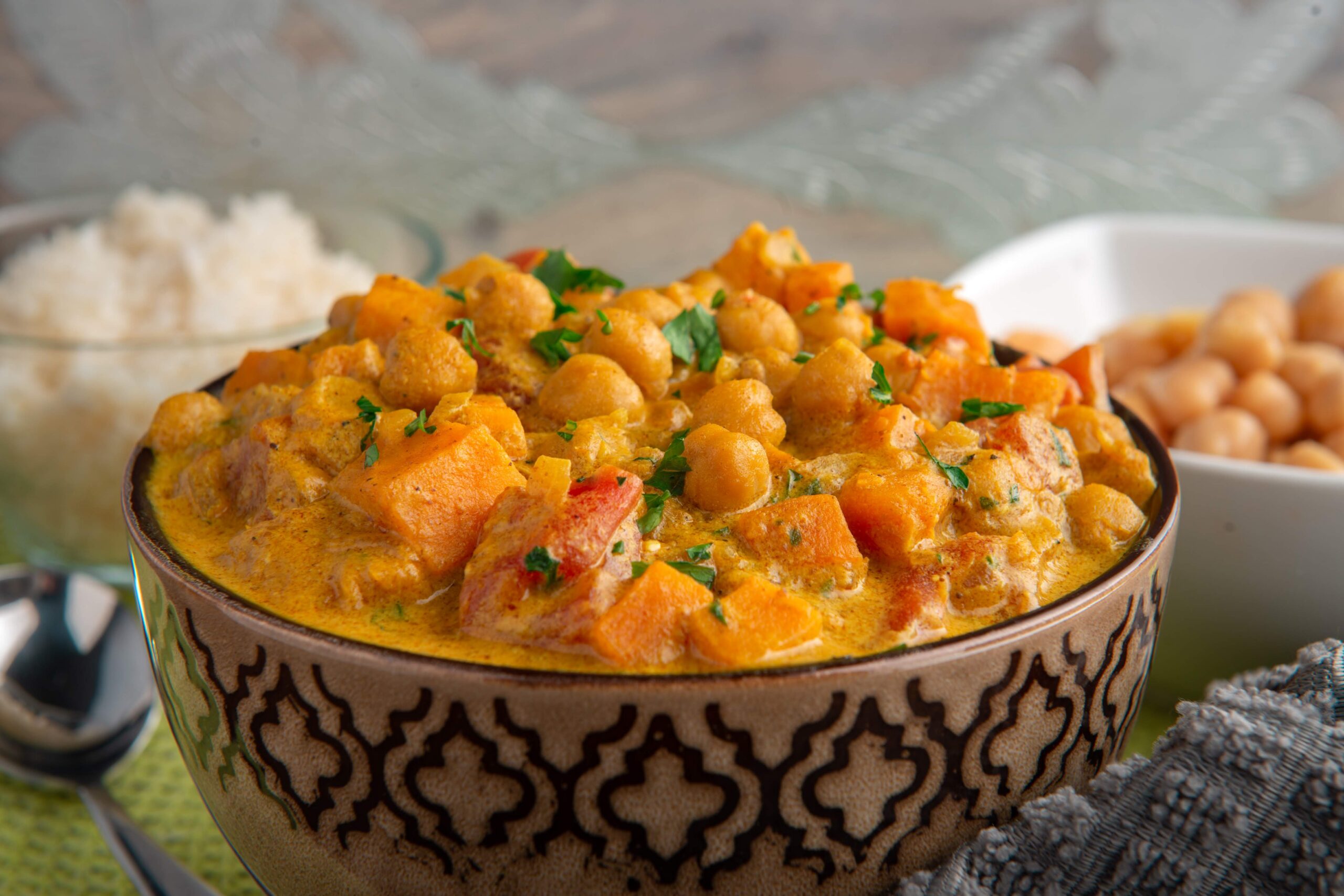 Garbanzos guisados con batata mameya in a rustic bowl served with rice, prepared by a private chef in Puerto Rico.