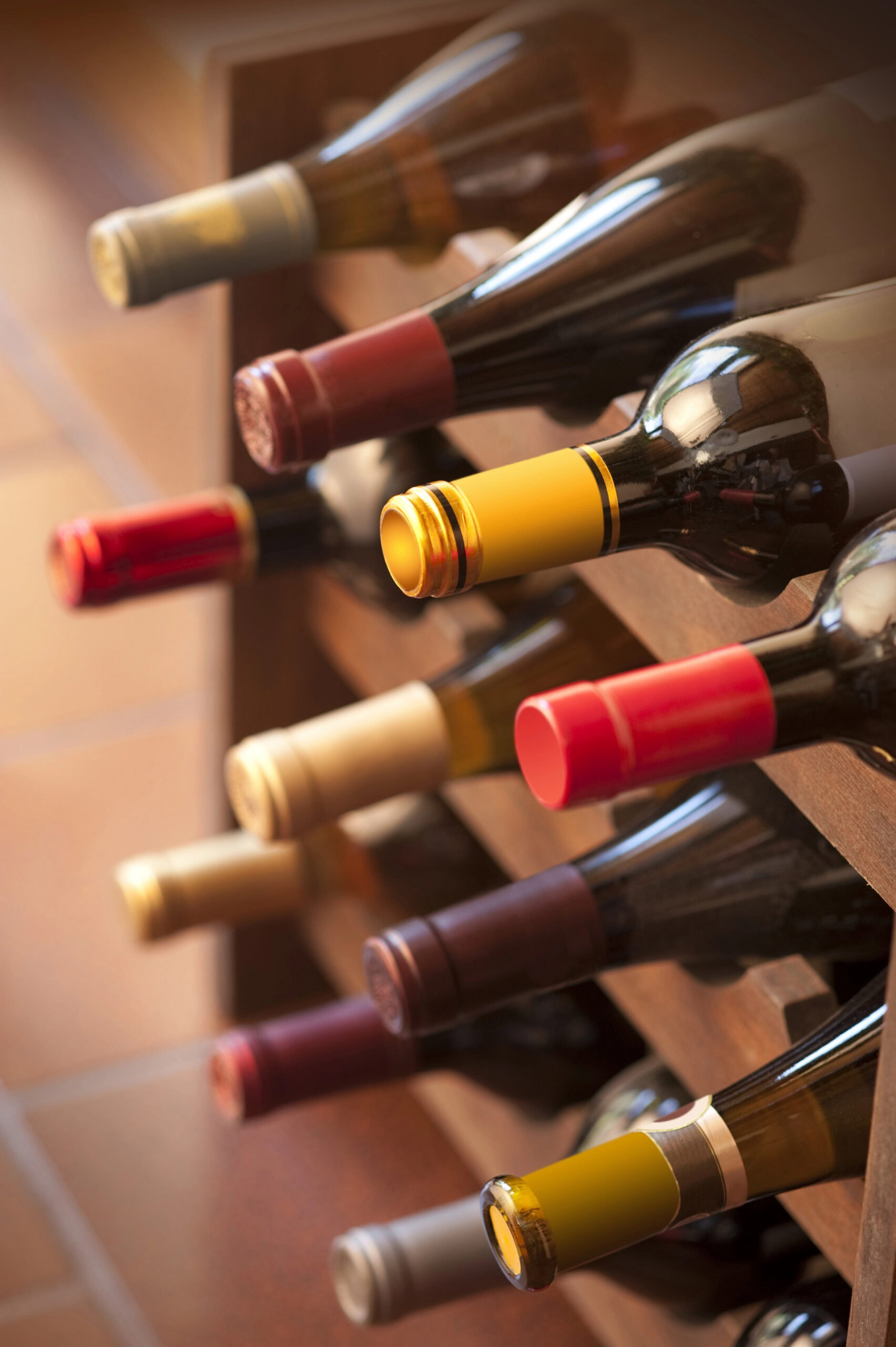 Assorted wine bottles on a rack representing curated wine selection for a private sommelier experience in Puerto Rico