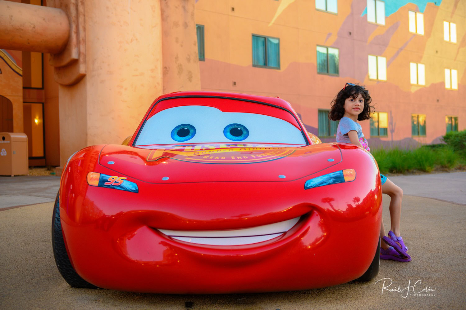 Child posing with Lightning McQueen at Disney Art of Animation Resort in Orlando
