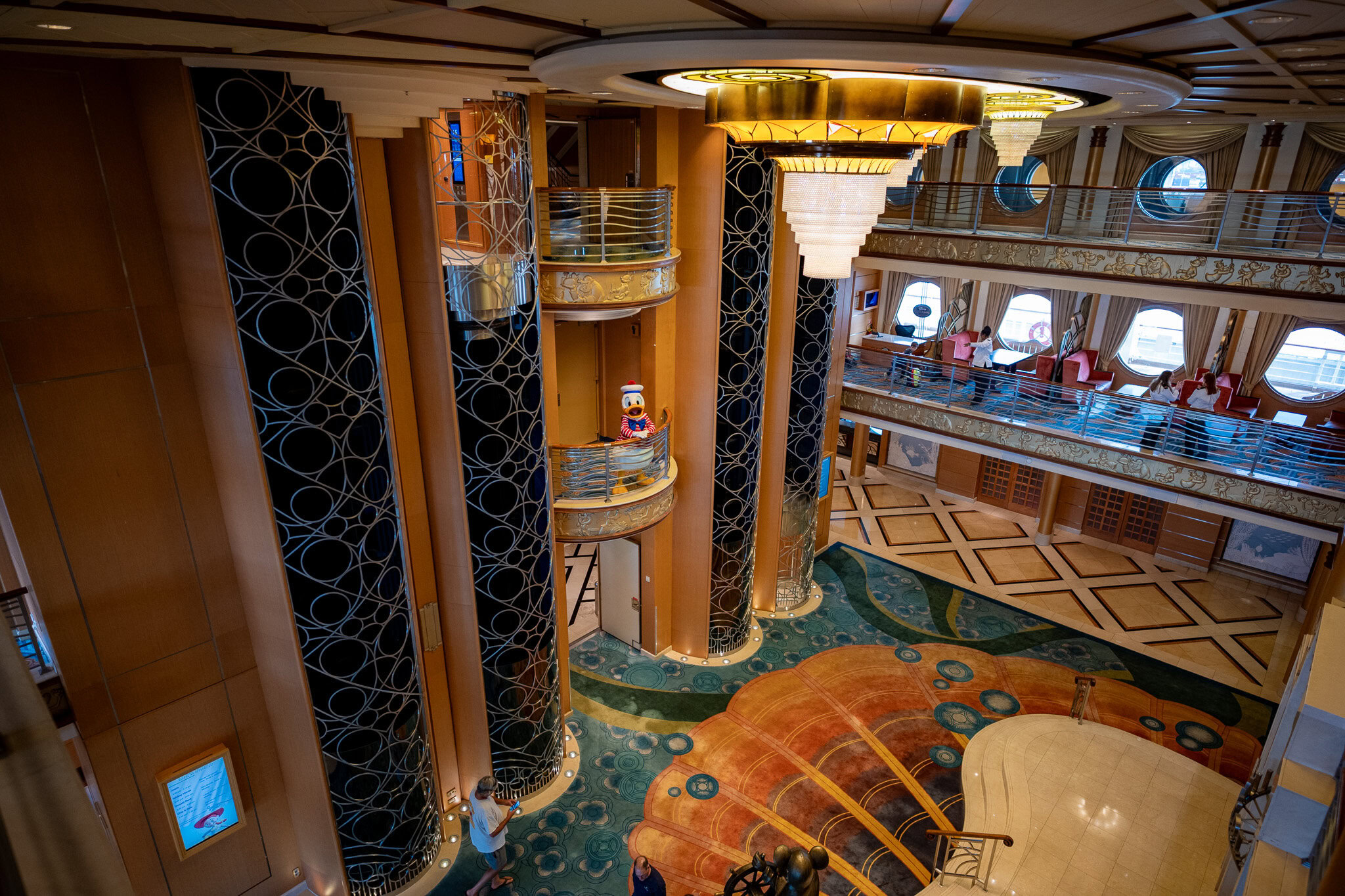 Sailor Donald in the Atrium – Disney Magic Sailor Donald Duck on a balcony of the Disney Magic