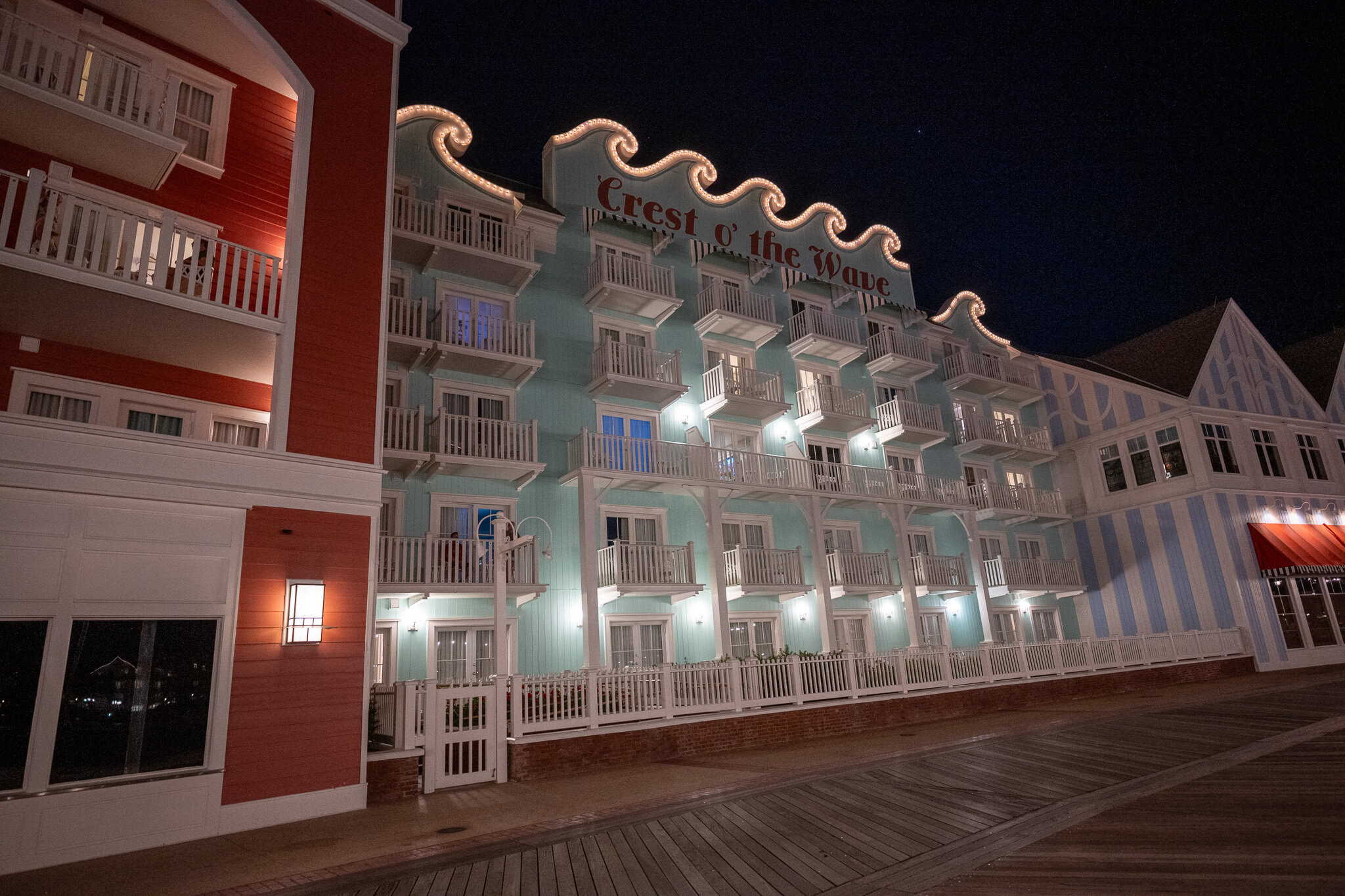 Exterior of Disney’s BoardWalk Resort lit up at night