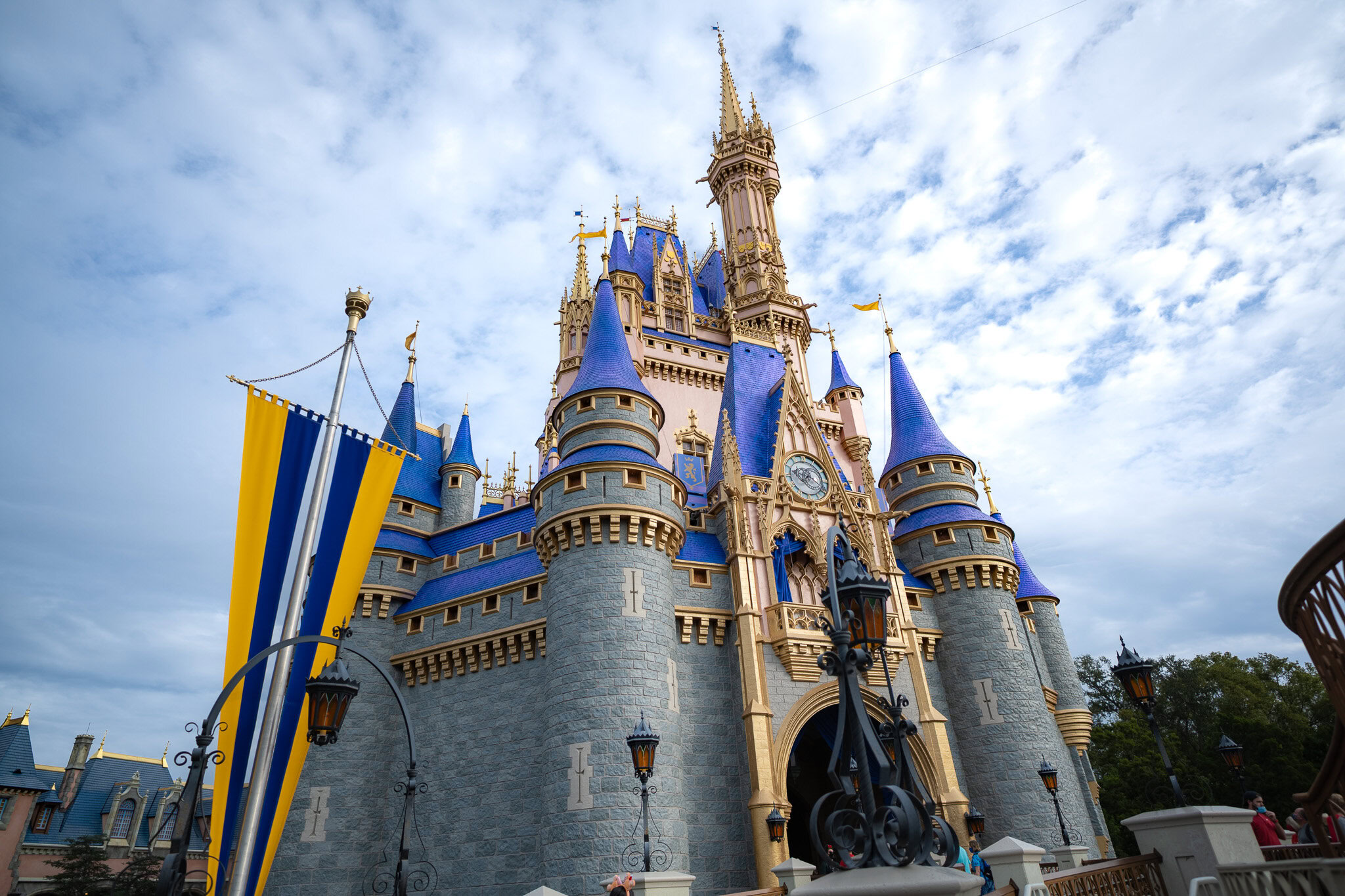 Cinderella Castle at Magic Kingdom in Walt Disney World beneath a bright blue sky.
