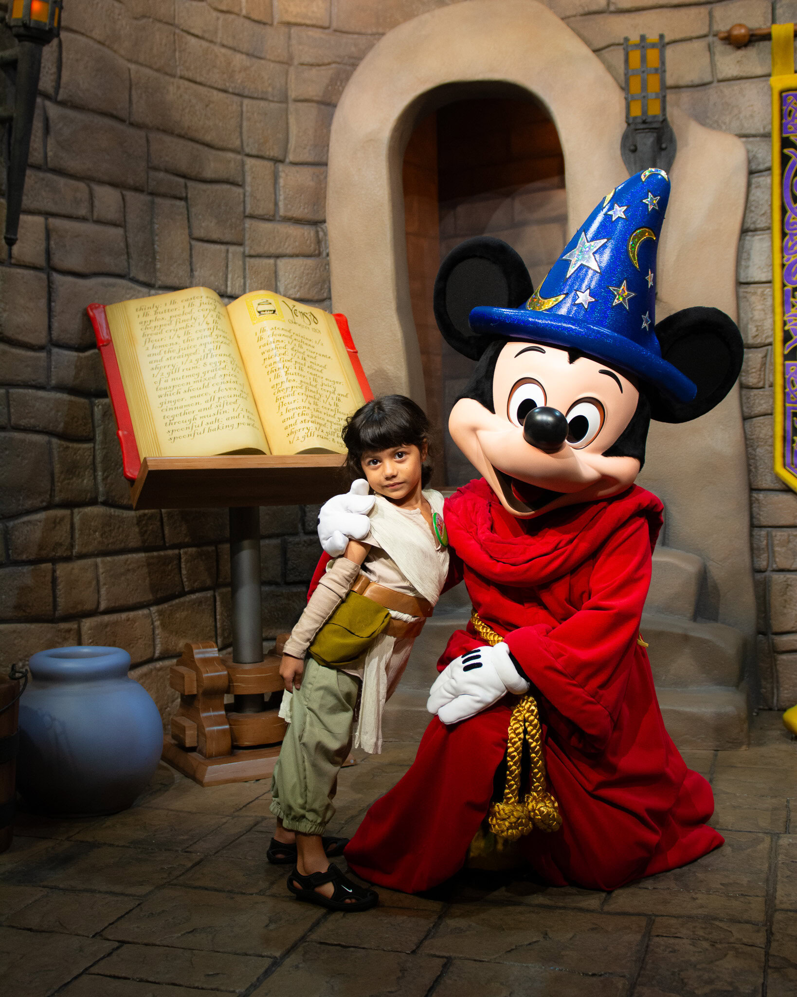 Child meeting Sorcerer Mickey at Disney's Hollywood Studios.