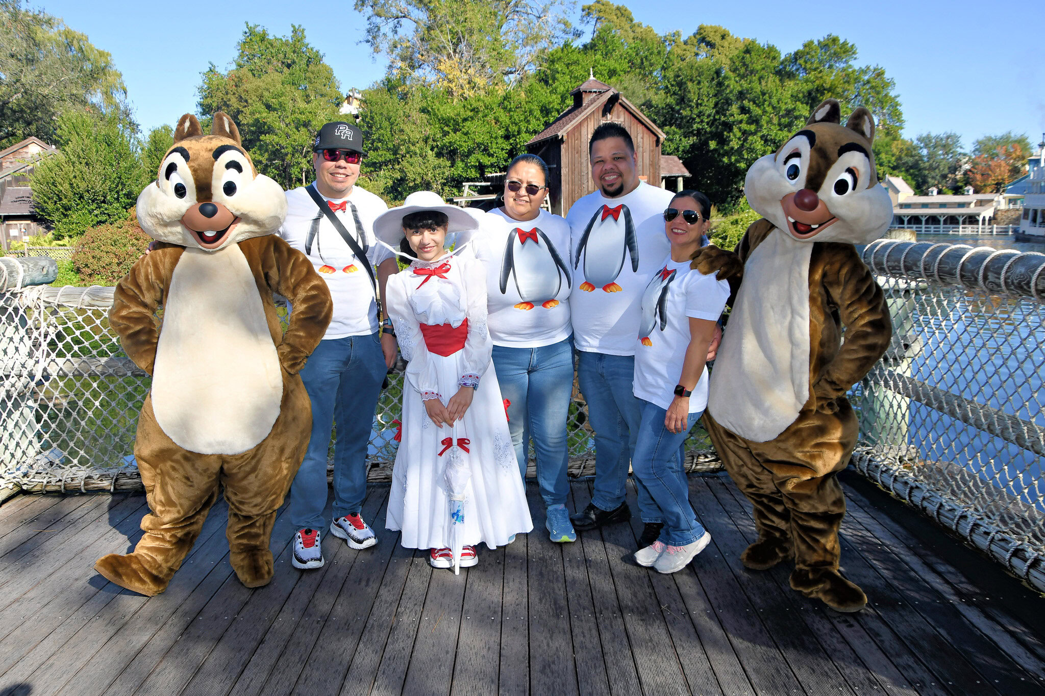 Raúl, Daniela dressed as Mary Poppins, Maria, Javier, and Lucilla pose with Chip and Dale during Mickey’s Not-So-Scary Halloween Party at Magic Kingdom Park.