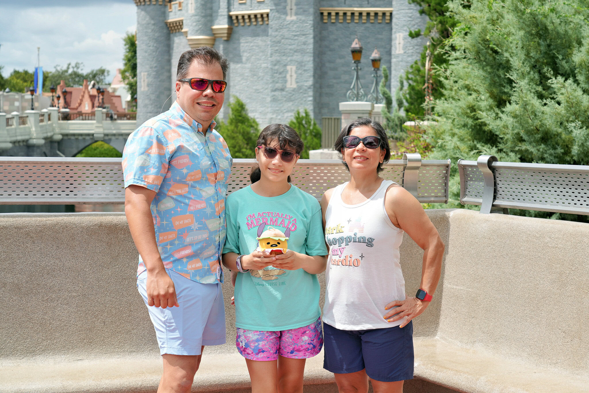 Raúl, Daniela, and Lucy in front of Cinderella Castle at Magic Kingdom Park.