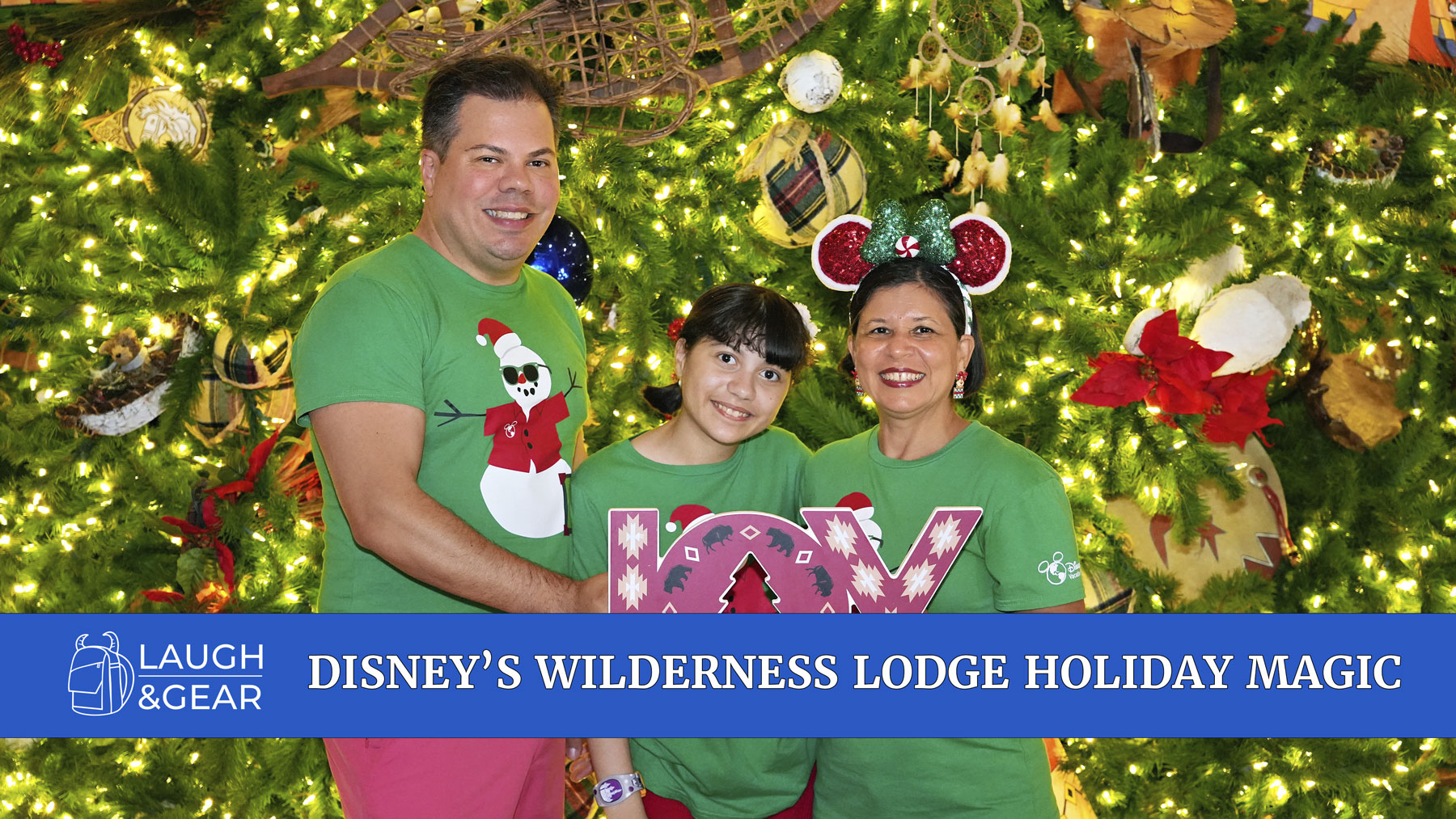 Raúl, Lucy, and Daniela posing in front of the Christmas tree at Disney’s Wilderness Lodge during the holidays