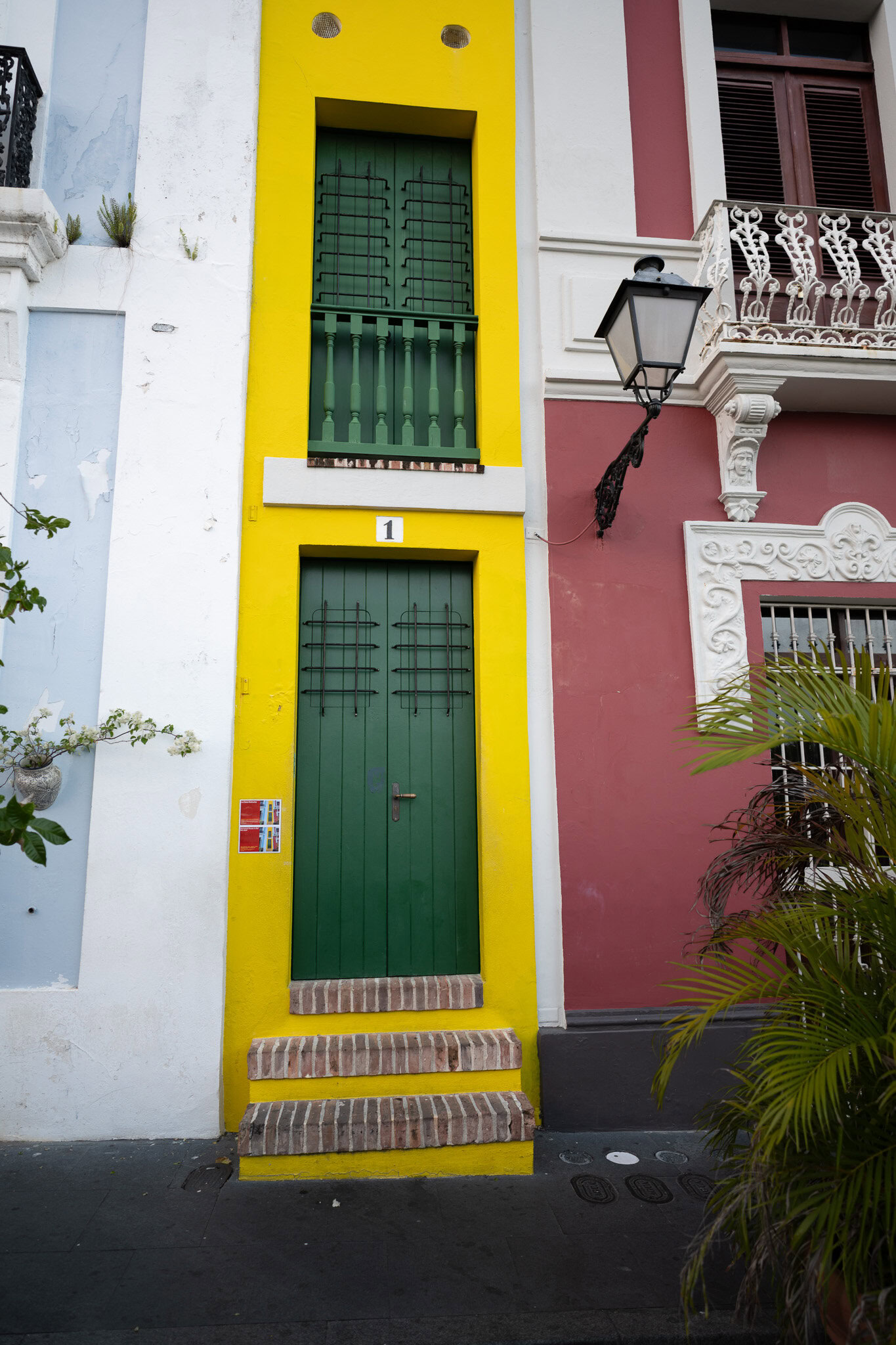 Puerto Rico’s narrowest house in Old San Juan with yellow facade and green doors