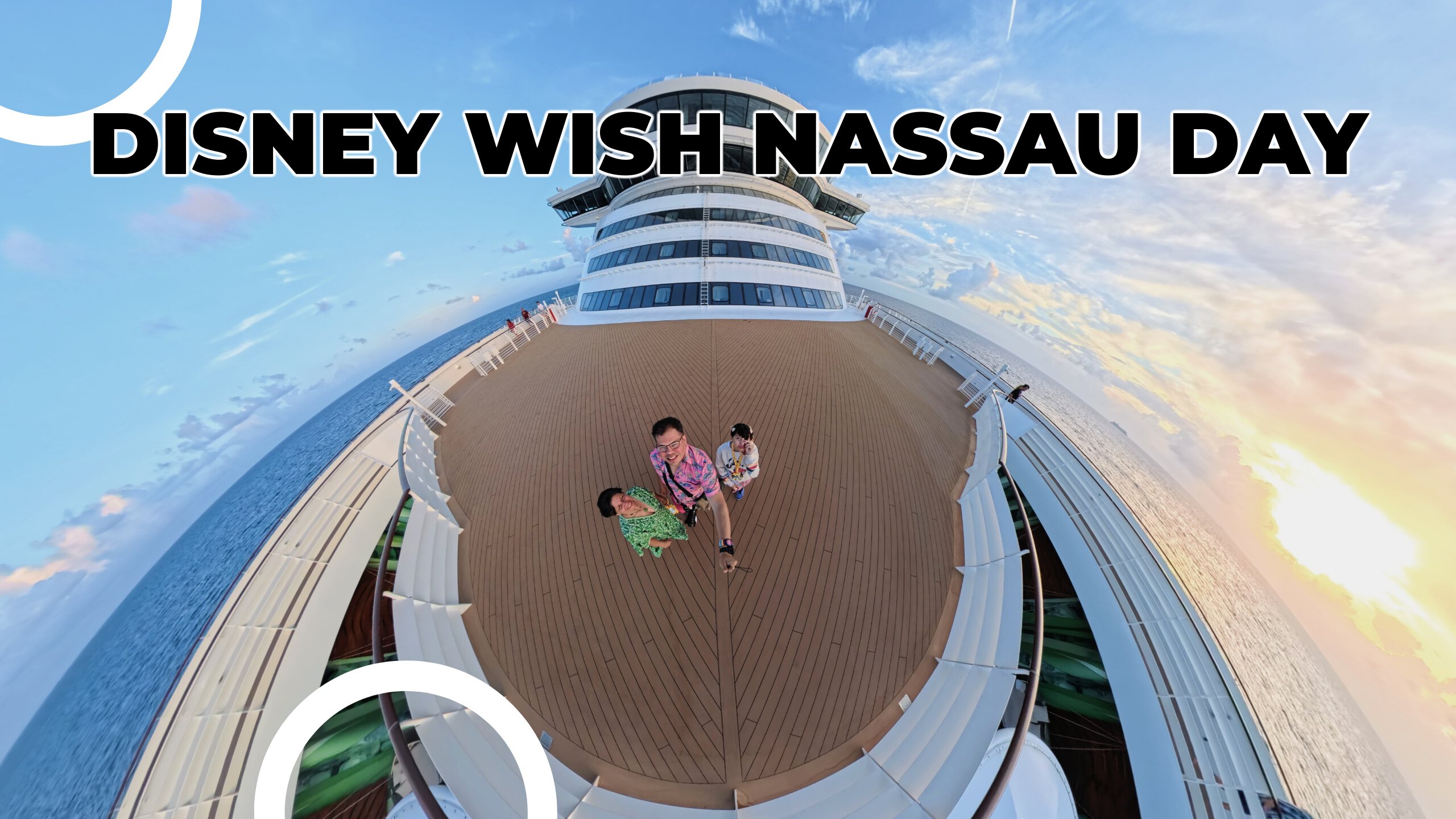 Lucy, Daniela, and Raúl standing on the front deck of the Disney Wish cruise ship during sunset, with the ocean and sky in the background.