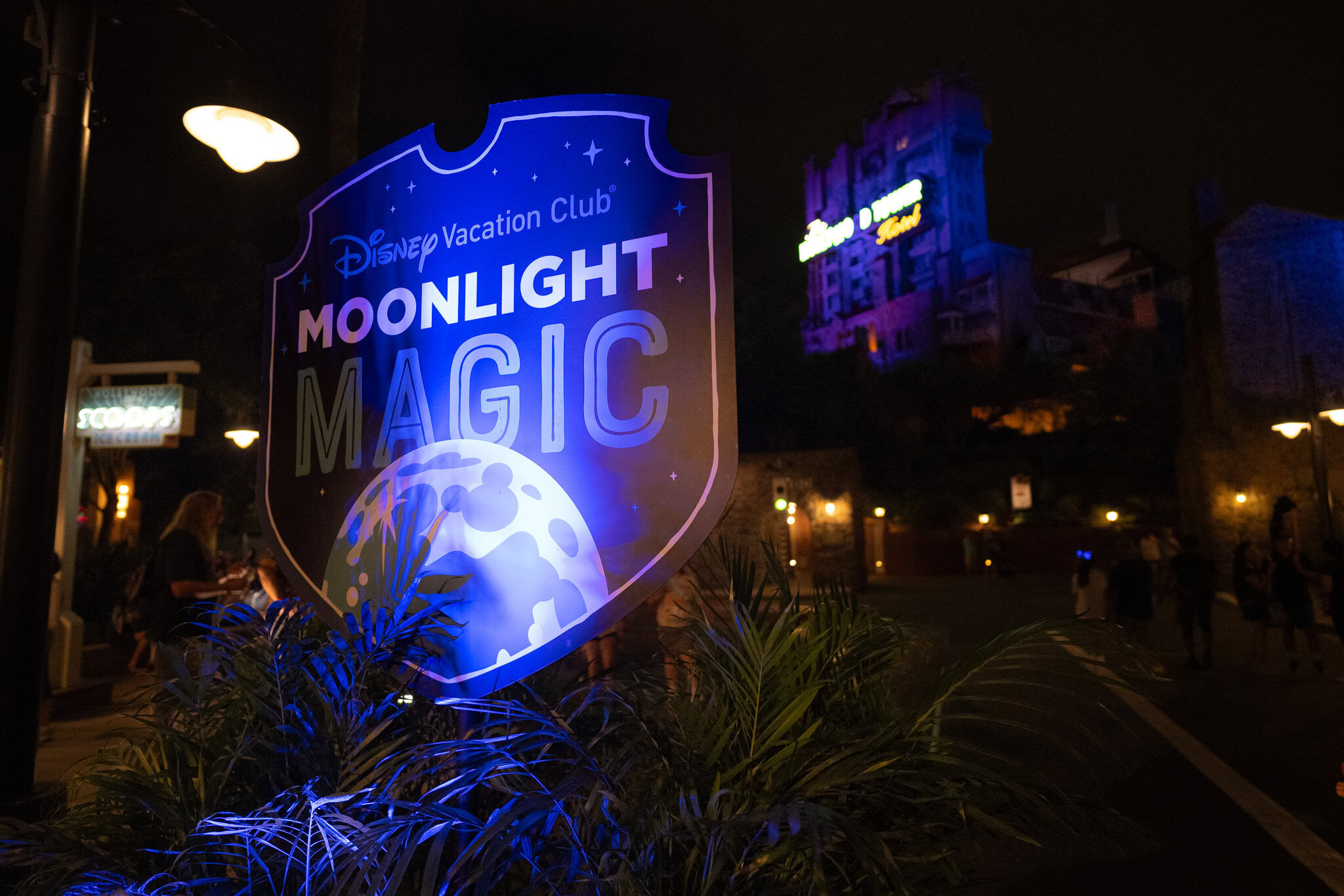 Moonlight Magic sign at Hollywood Studios with Tower of Terror Disney Vacation Club Moonlight Magic sign with Tower of Terror in background