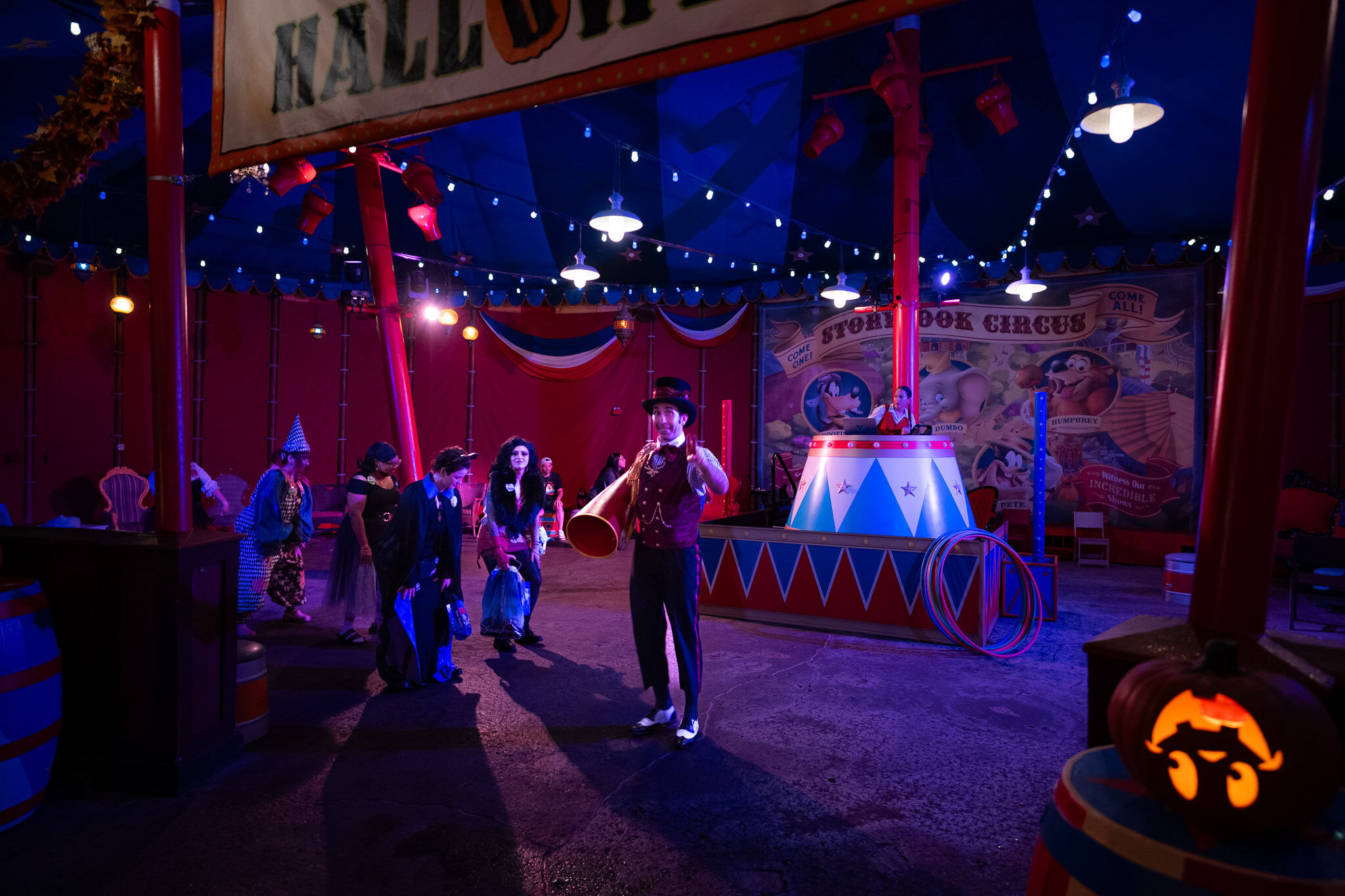 Ringmaster welcoming guests inside Storybook Circus tent during MNSSHP
