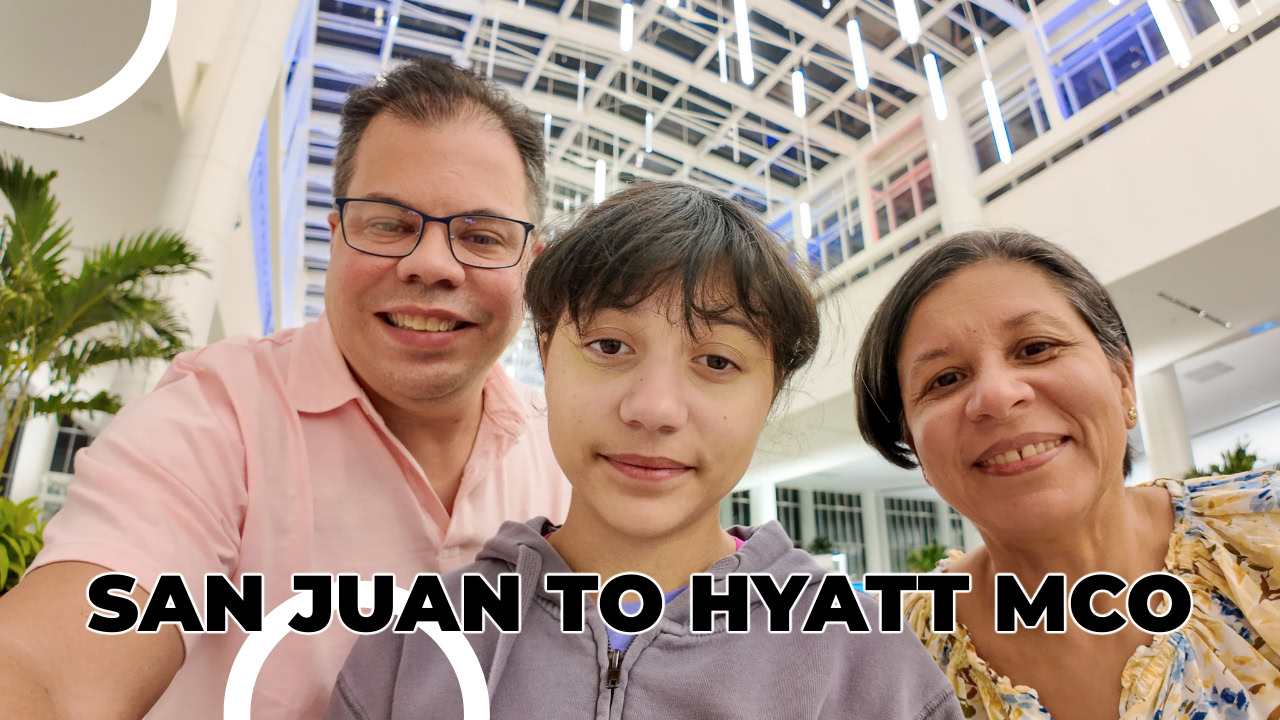 Raúl, Daniela, and Lucy smiling at Hyatt Regency MCO after arriving from San Juan to start their Disney vacation