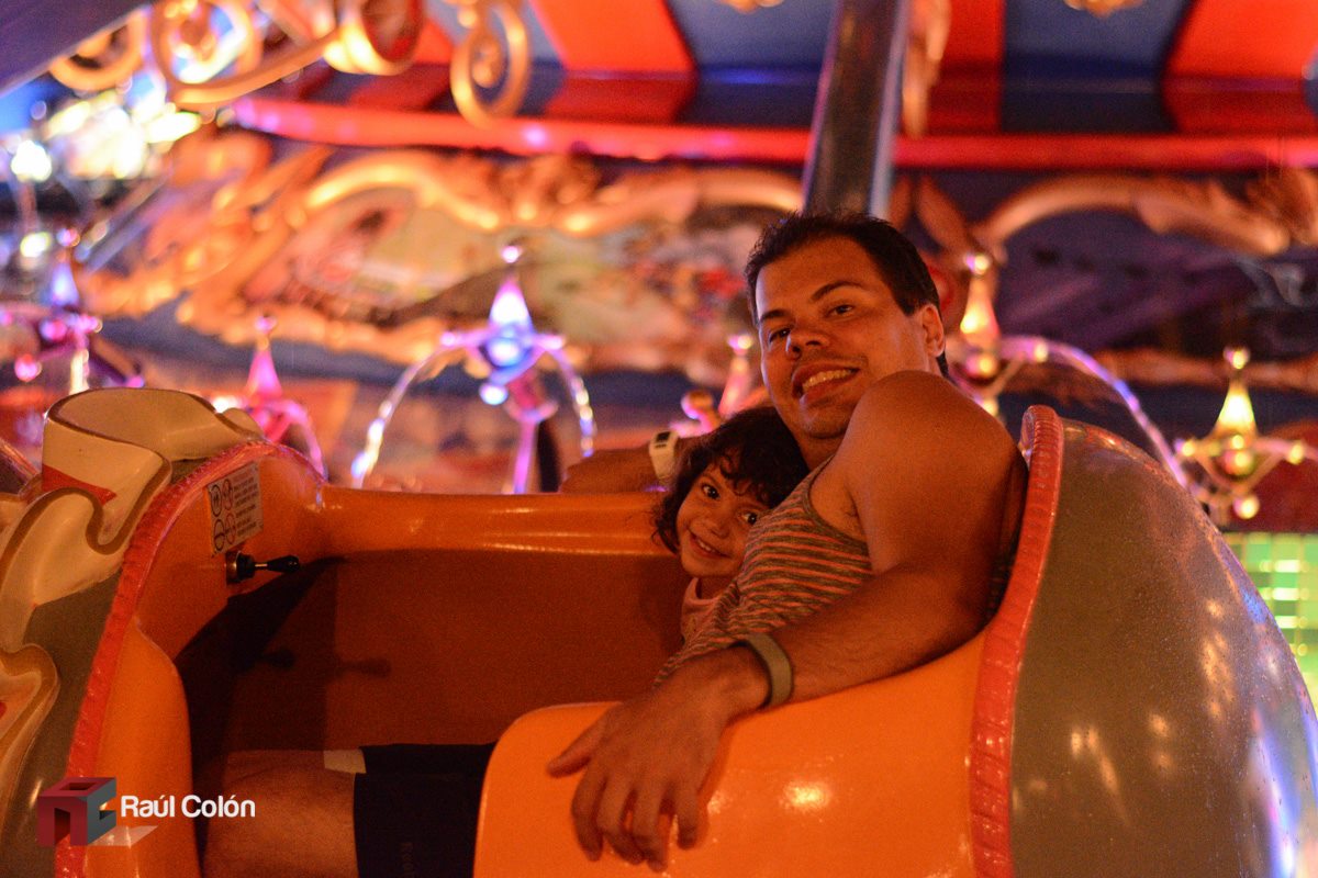 Dad and young daughter riding Dumbo the Flying Elephant at Walt Disney World in 2014