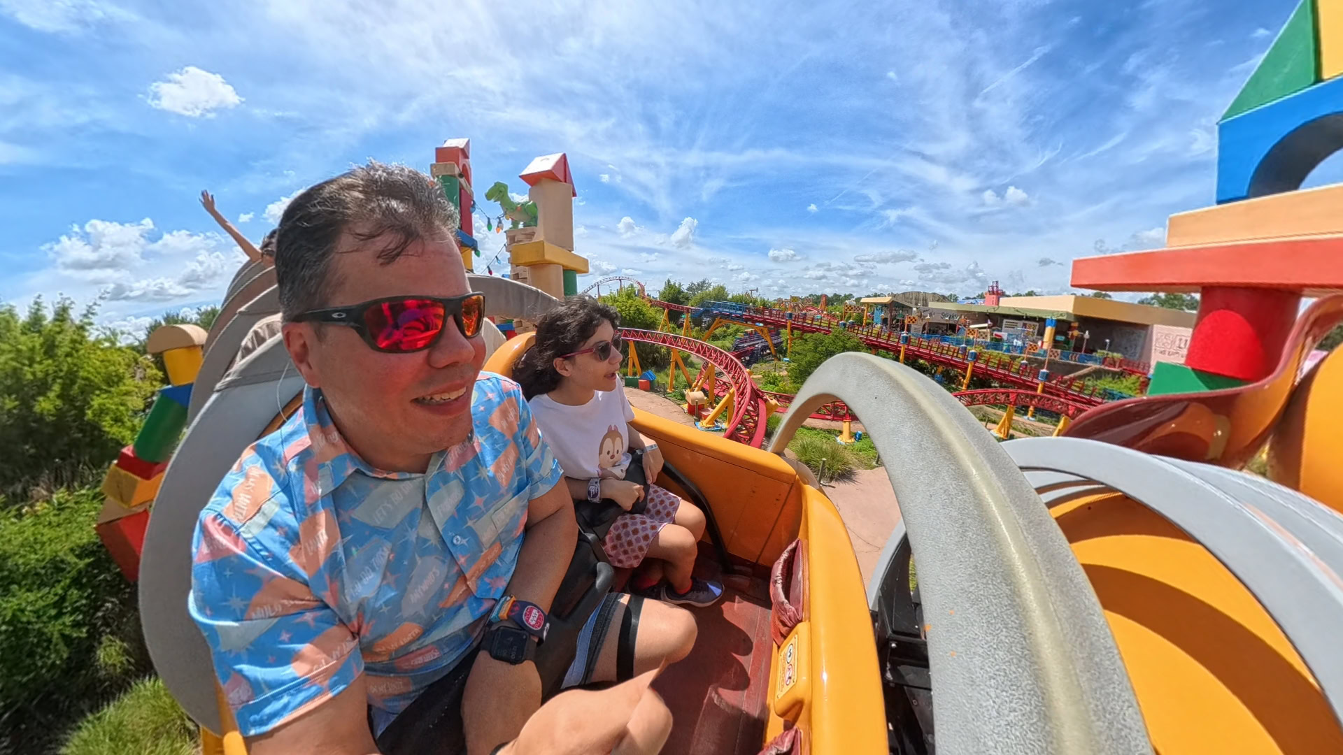Dad and young daughter riding Slinky Dog Dash roller coaster at Disney’s Hollywood Studios