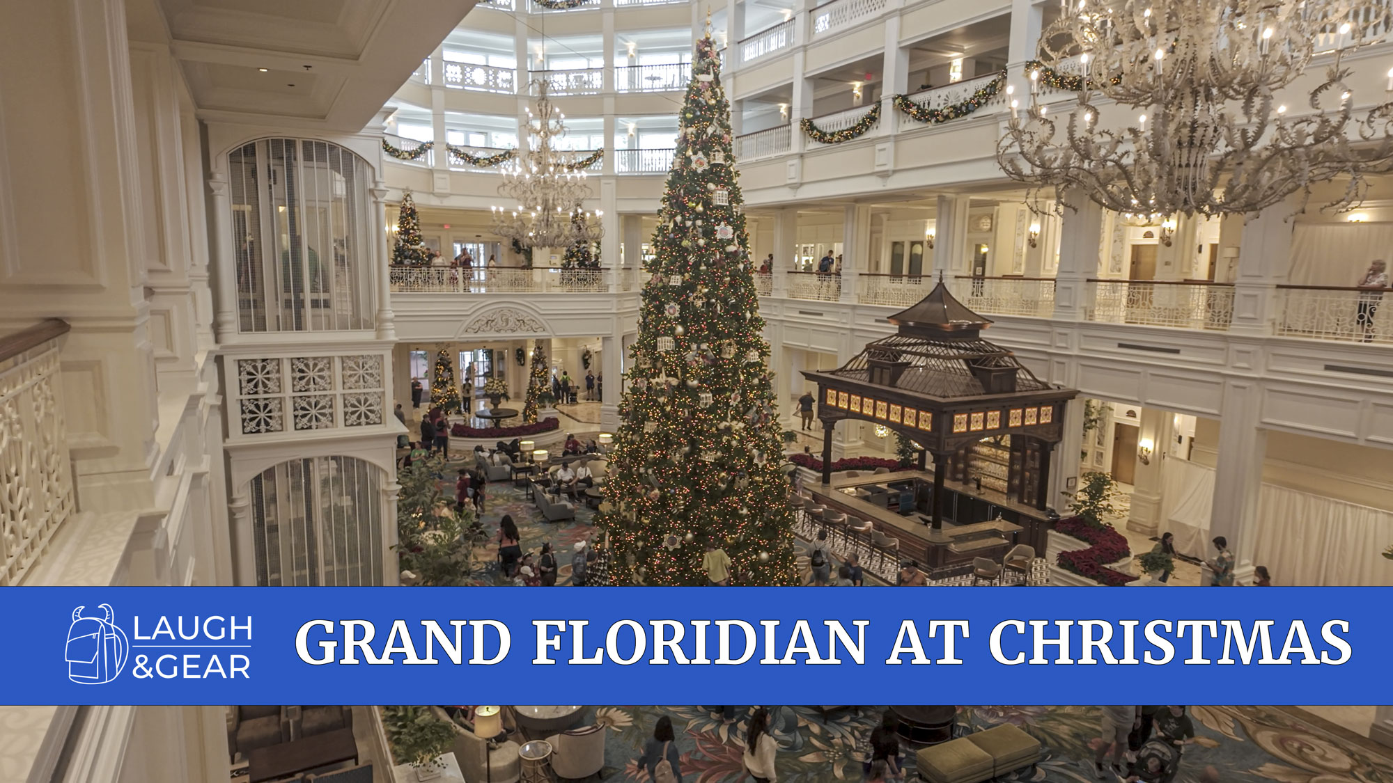 Grand Floridian Resort lobby decorated for Christmas with large holiday tree and chandeliers at Walt Disney World.