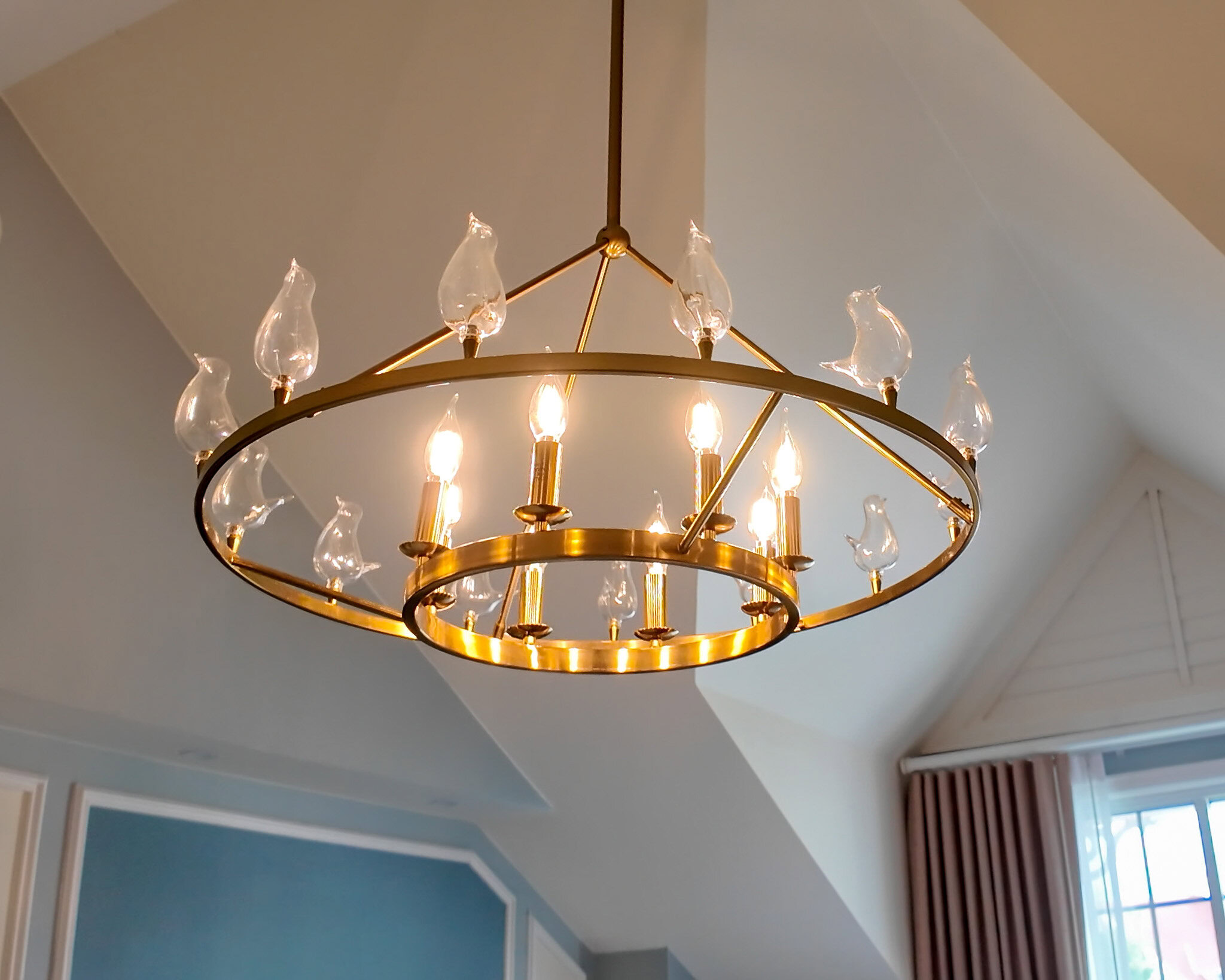 Mary Poppins themed chandelier with decorative birds inside a Grand Floridian Resort Studio room.
