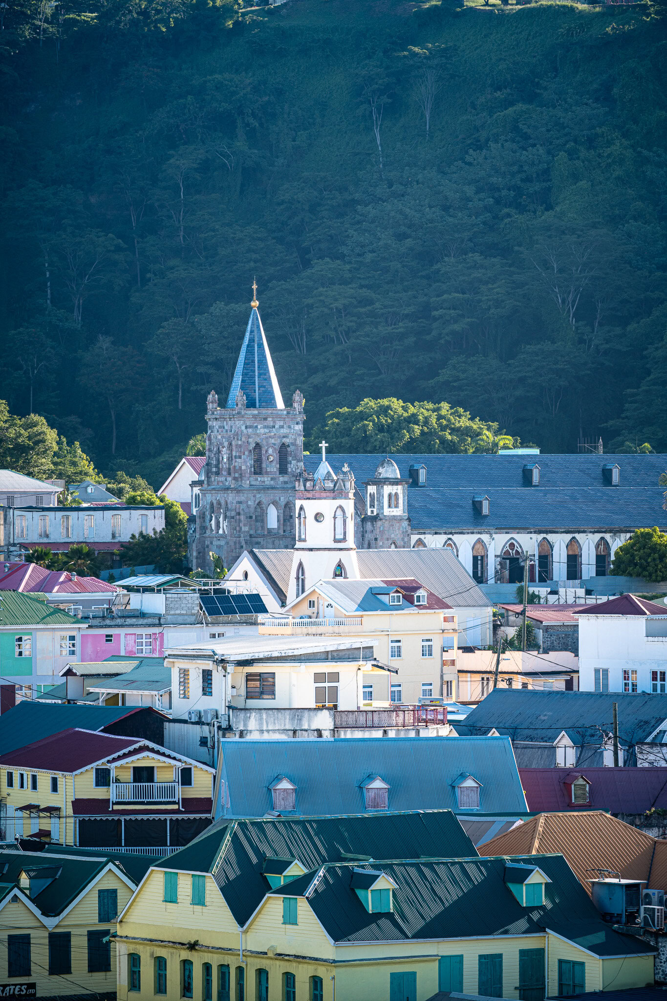 Historic church surrounded by colorful buildings in Dominica