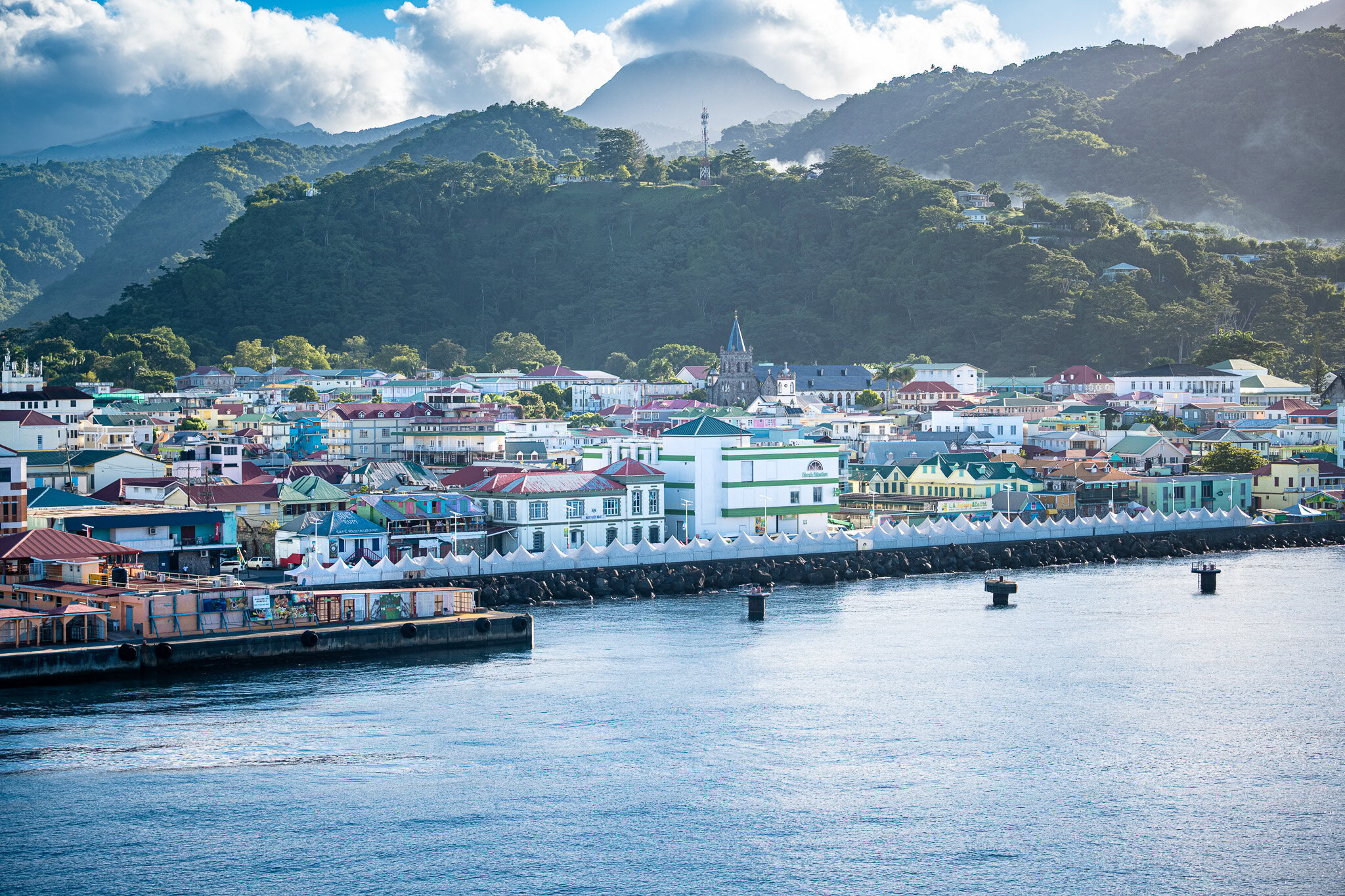 Colorful buildings and mountains seen from the Dominica cruise port