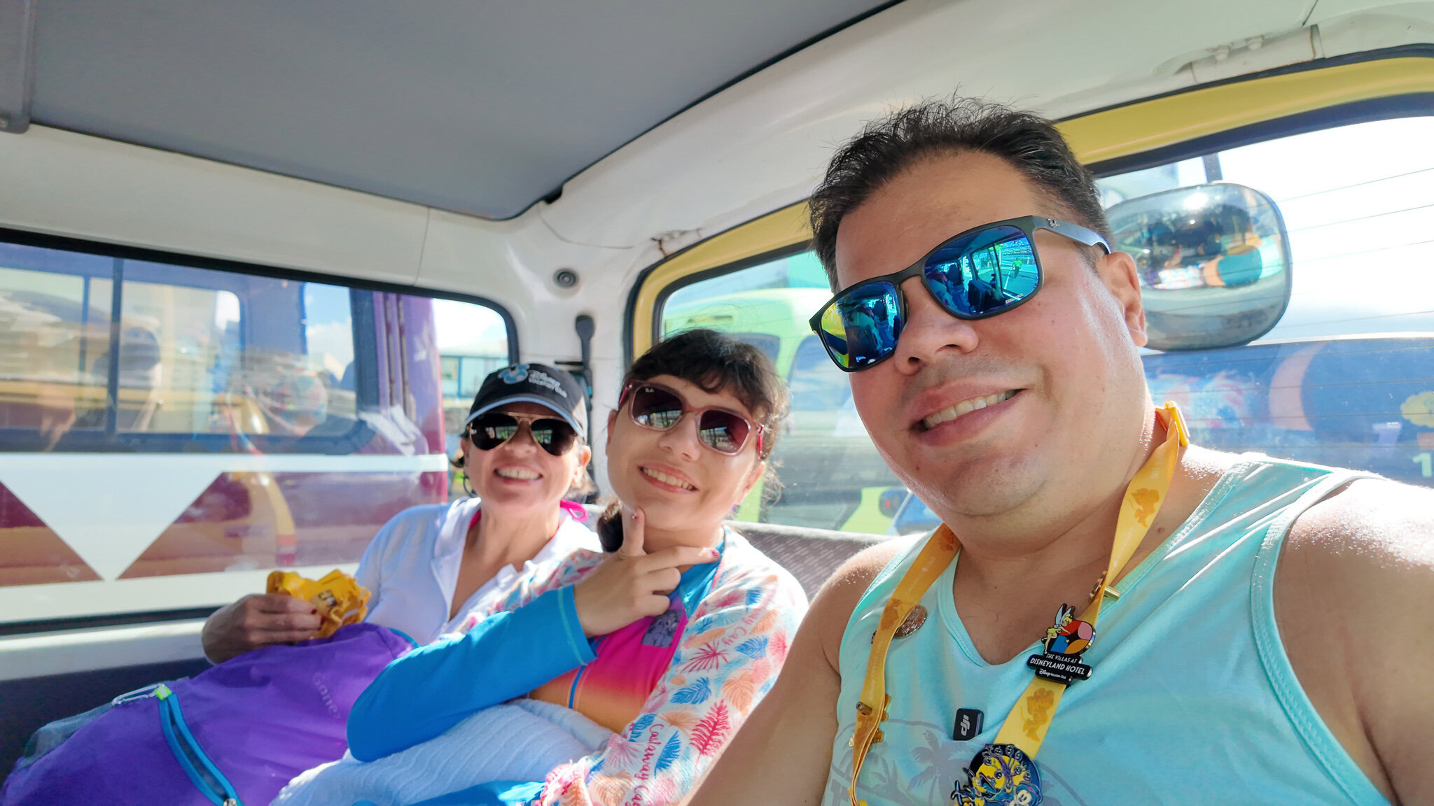 Ra&uacute;l, Lucy, and Daniela smiling inside a taxi near the Dominica cruise port