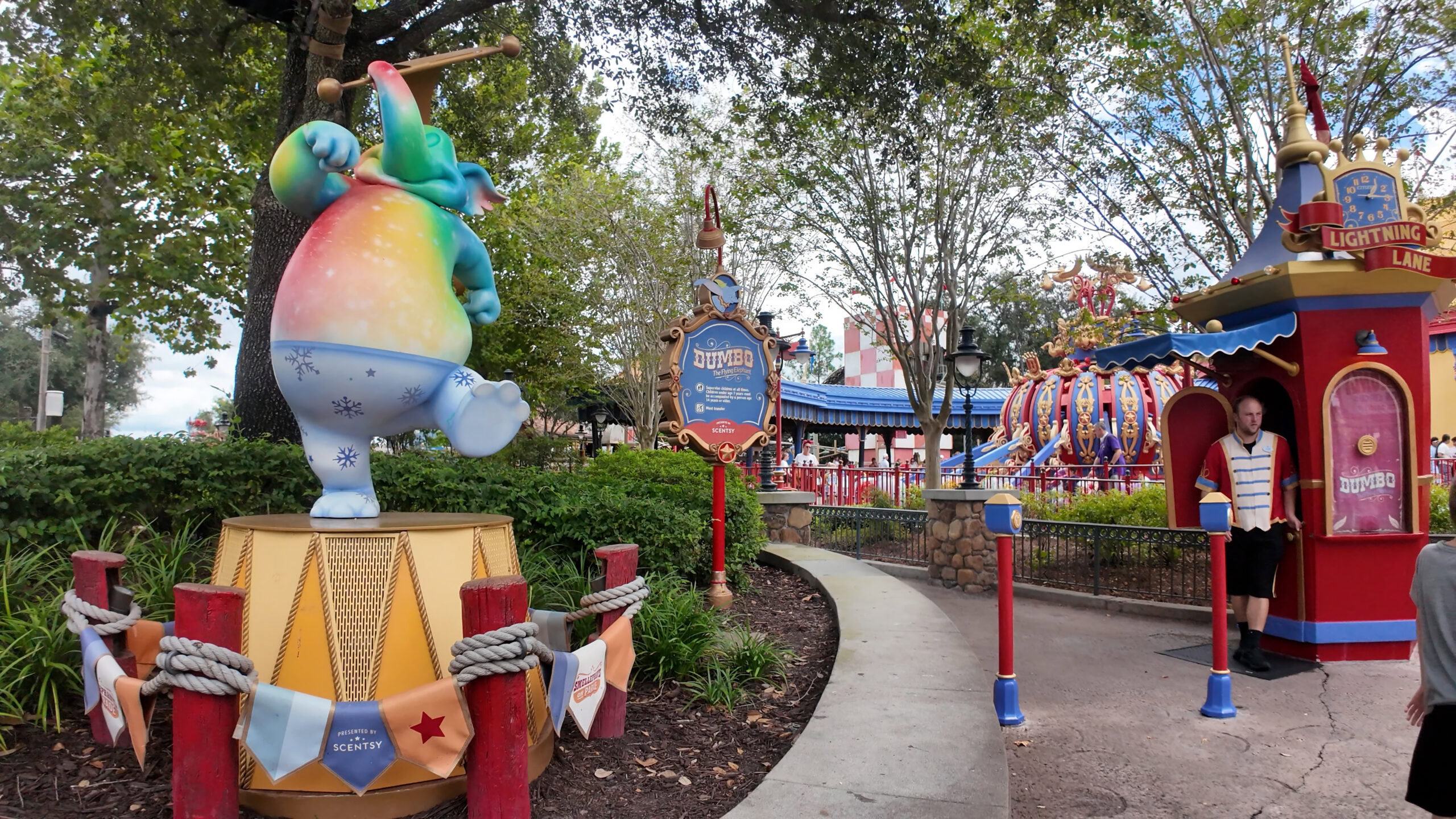 Guests smelling a scent station at Smellephants on Parade in Storybook Circus at Magic Kingdom