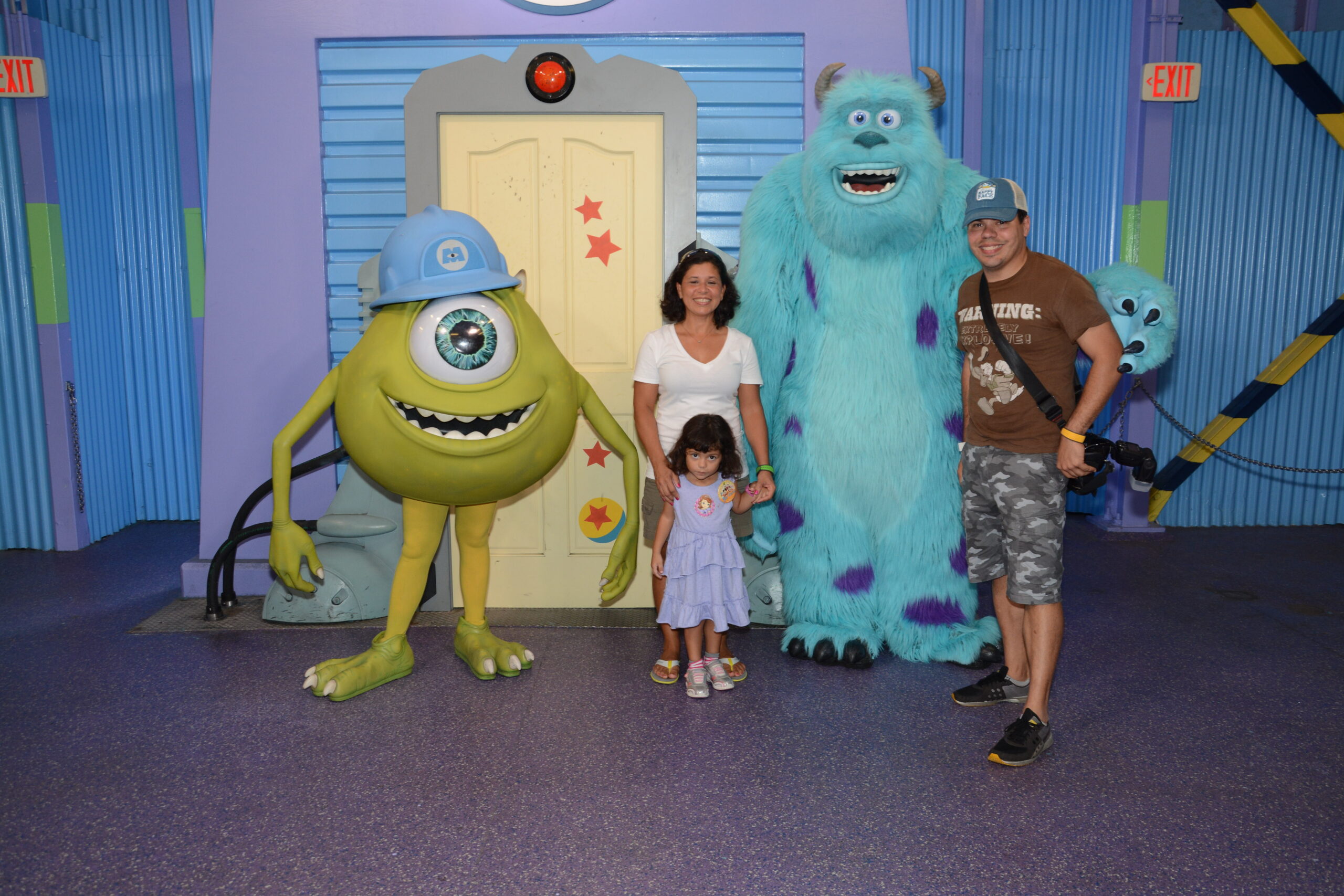 Daniela, Lucy, and Raúl posing with Mike Wazowski and Sulley at Disney’s Hollywood Studios.