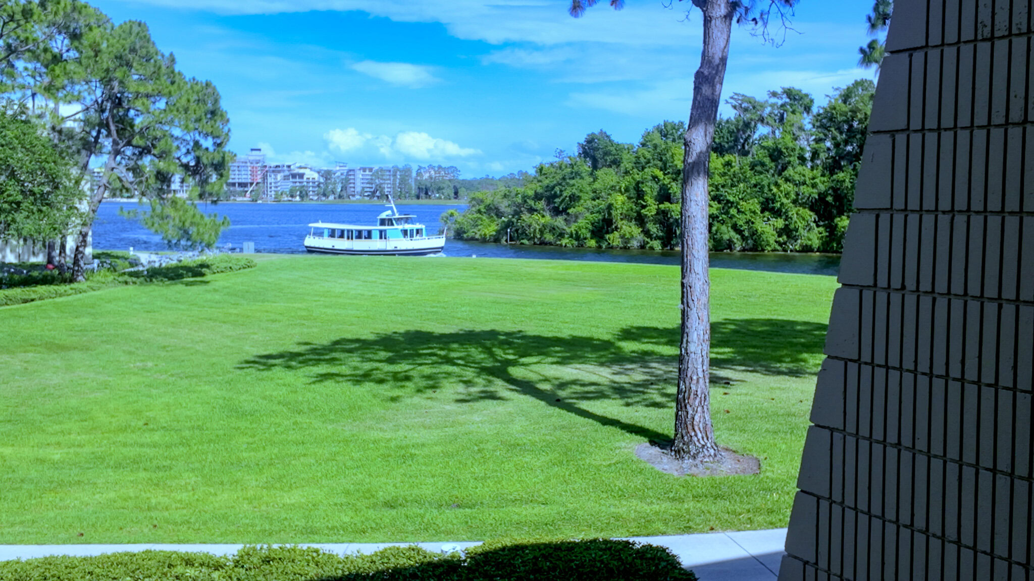 Resort boat traveling on Bay Lake, viewed from Disney’s Contemporary Resort Garden Wing.