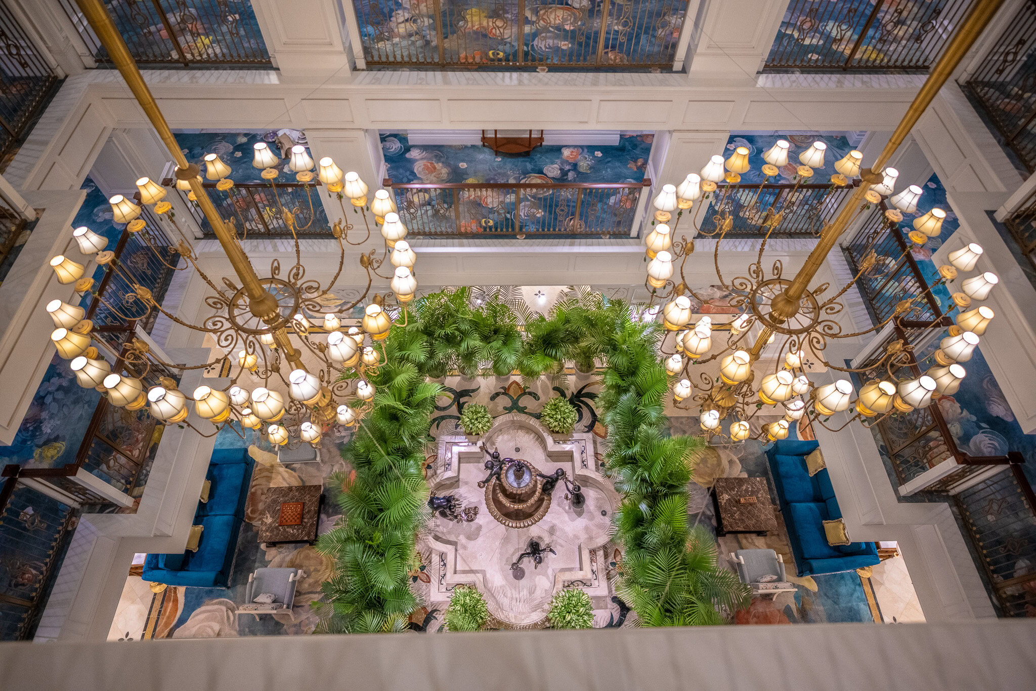 Overhead view of the Grand Floridian Disney Vacation Club Villas lobby with Mary Poppins penguin fountains.