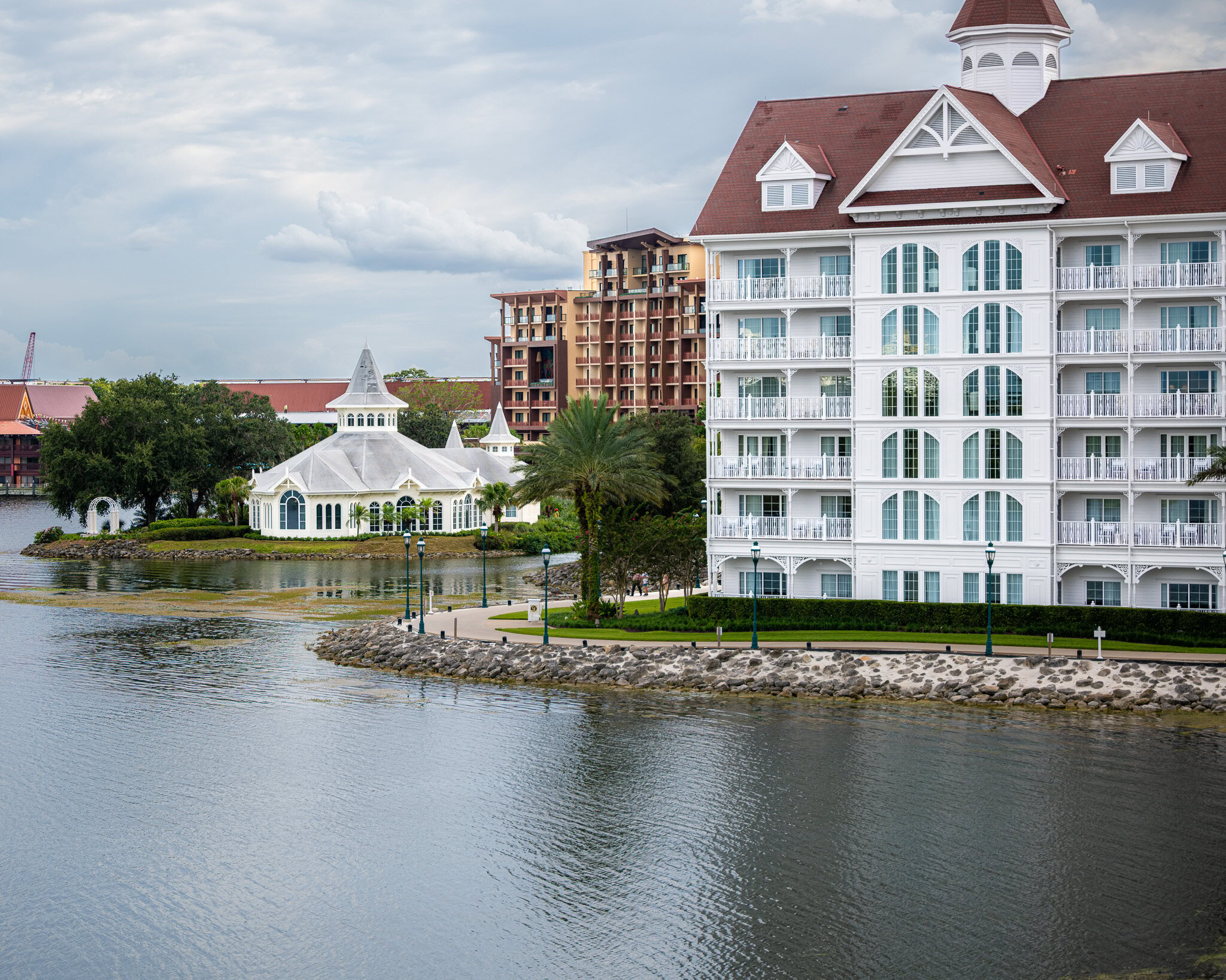 Disney&rsquo;s Grand Floridian Resort and Polynesian Island Tower viewed across Seven Seas Lagoon.