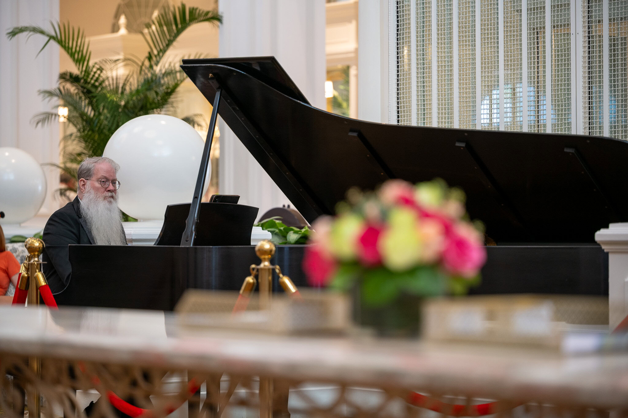 Pianist performing in the lobby at Disney&rsquo;s Grand Floridian Resort.