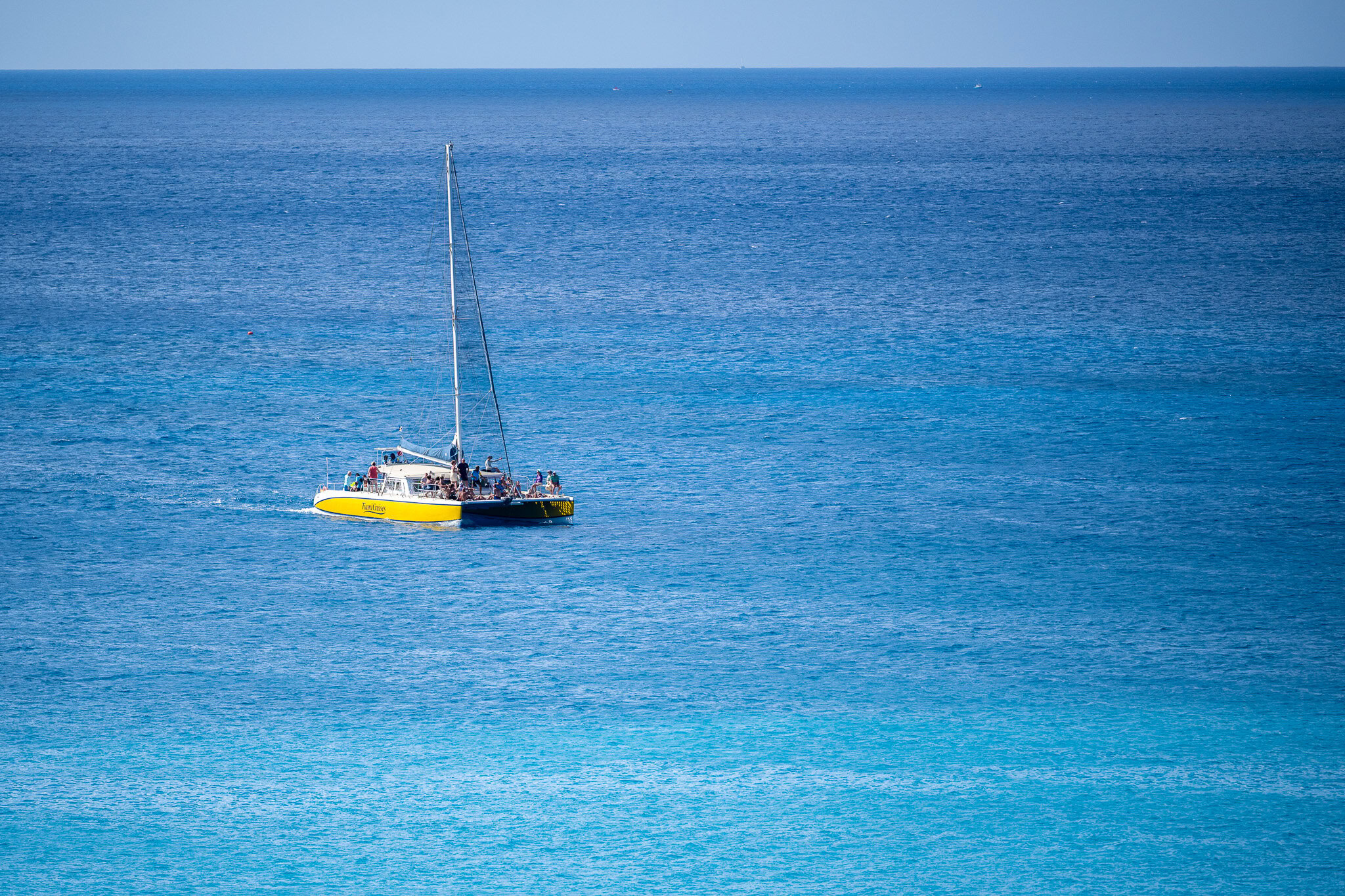 Catamaran sailing across the Caribbean Sea near Barbados cruise port.