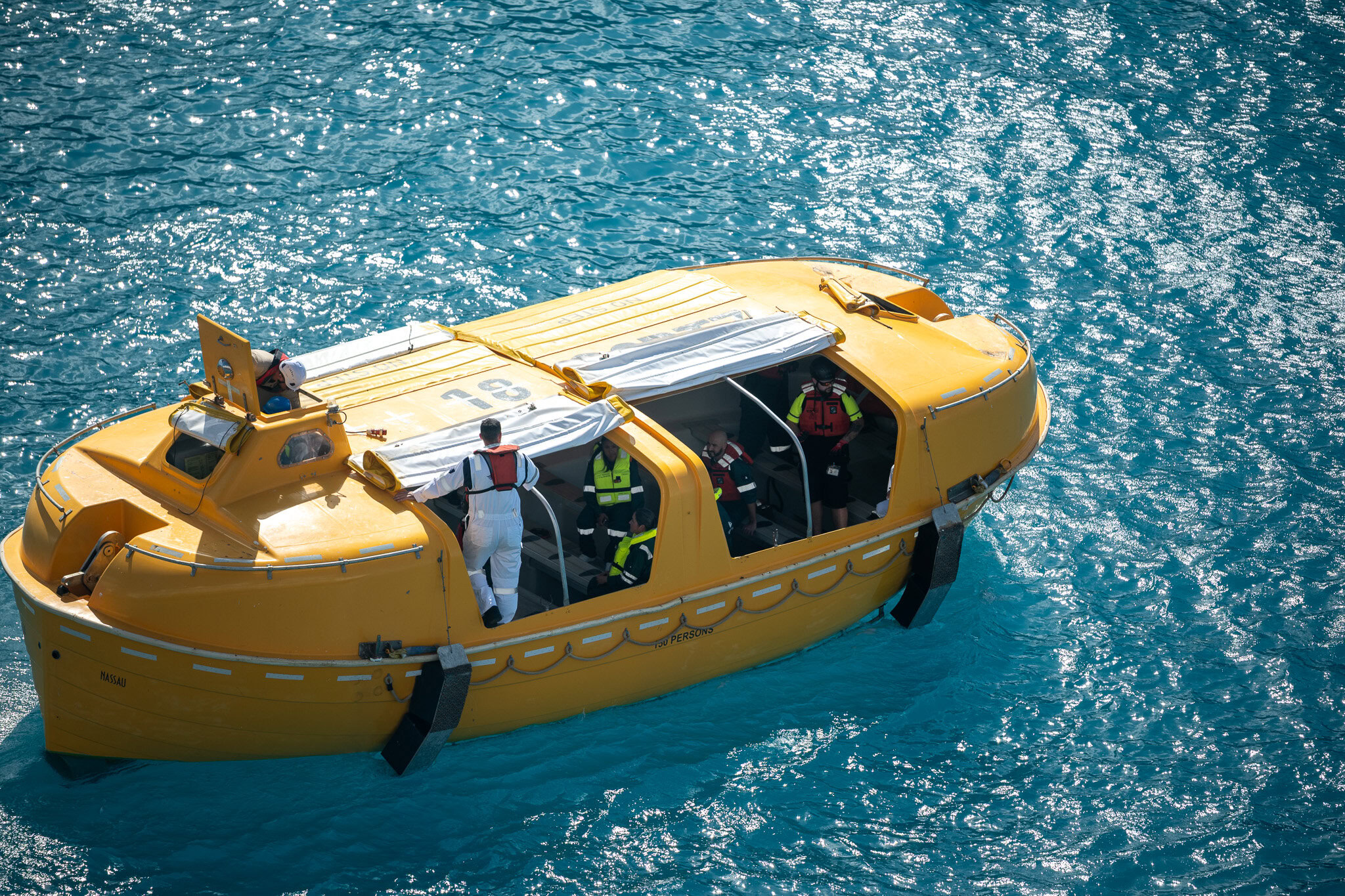 Disney Magic crew conducting lifeboat safety training near the Barbados cruise port.