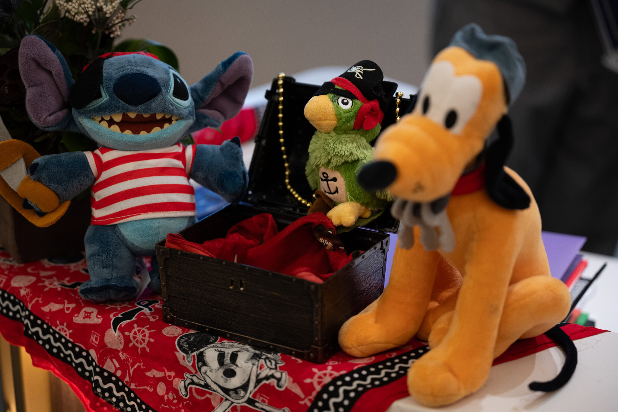 Pirate themed Disney plush display with Stitch and Pluto in the Disney Magic Concierge Lounge.