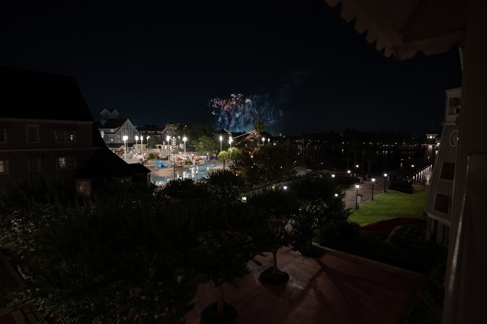 Fireworks at night viewed over Stormalong Bay at Disney’s Yacht Club Resort