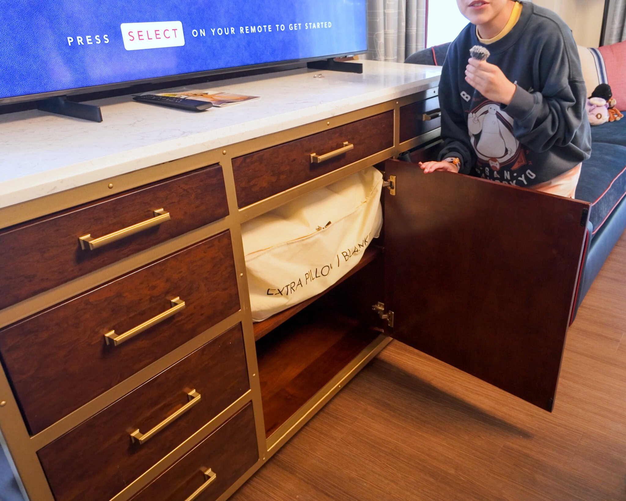 Storage drawers and cabinet inside a Disney’s Yacht Club Resort room