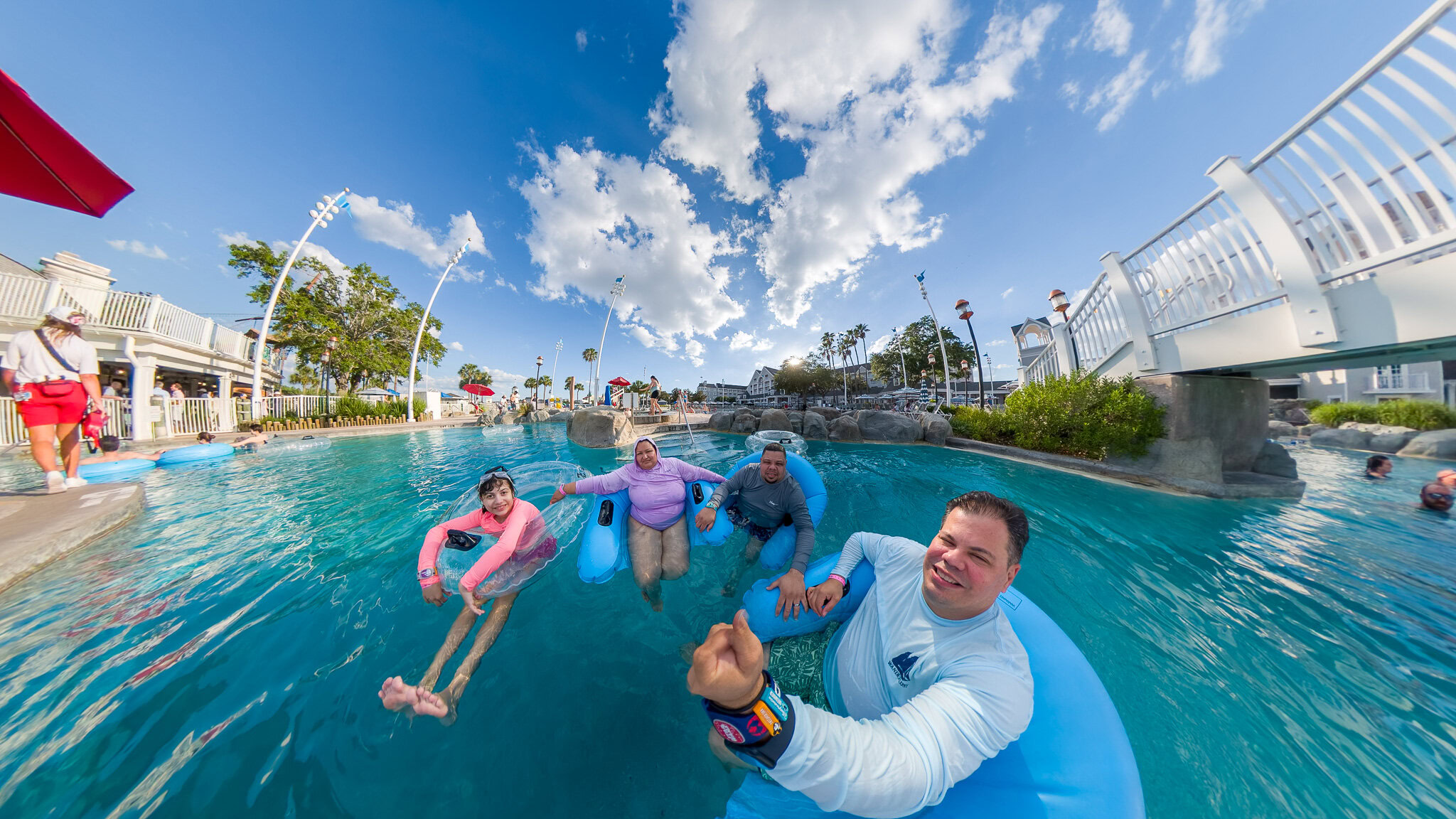 Family floating in the Stormalong Bay lazy river at Disney’s Yacht Club Resort
