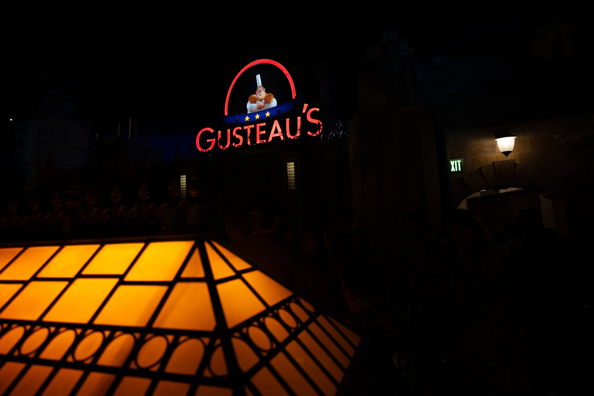Gusteau’s Sign Above Ratatouille Ride Gusteau’s neon sign at night above Remy’s Ratatouille Adventure at Epcot