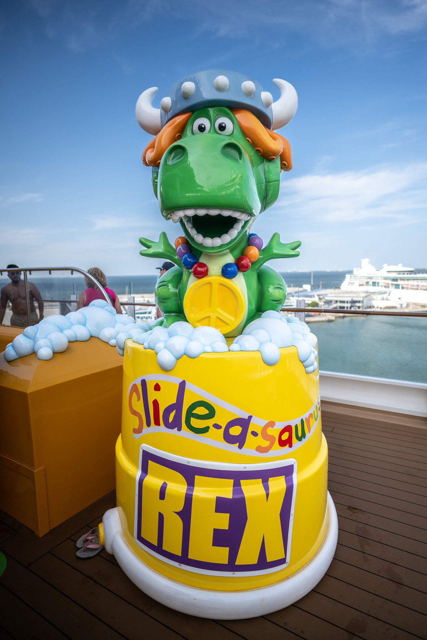 Rex from Toy Story in the kids water play area on Disney Wish