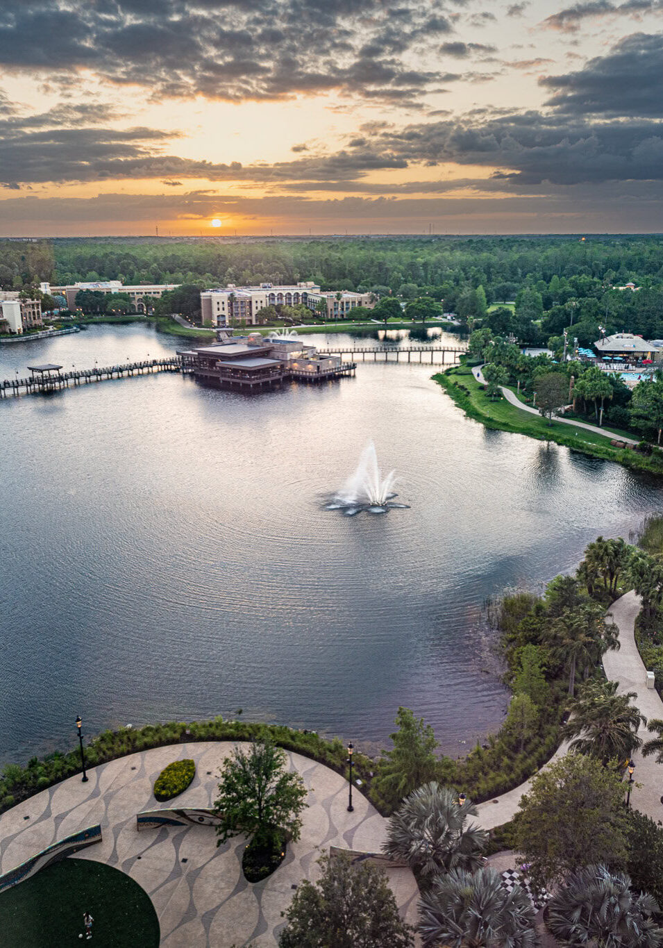 Aerial sunset view of Disney’s Coronado Springs Resort and lake, captured from Gran Destino Tower