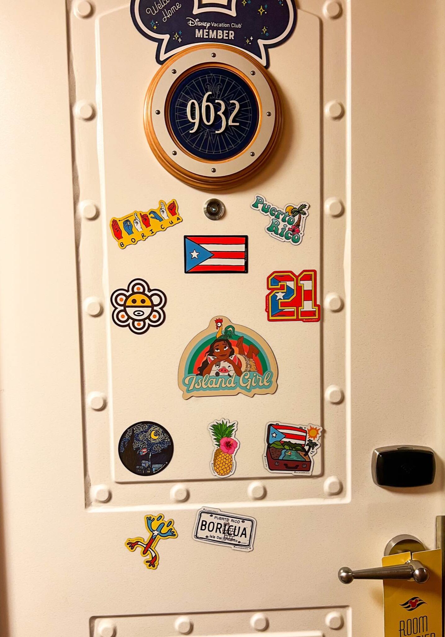 Disney cruise cabin door number 9632 decorated with Puerto Rican-themed magnets including flags, coquí frogs, and tropical designs.
