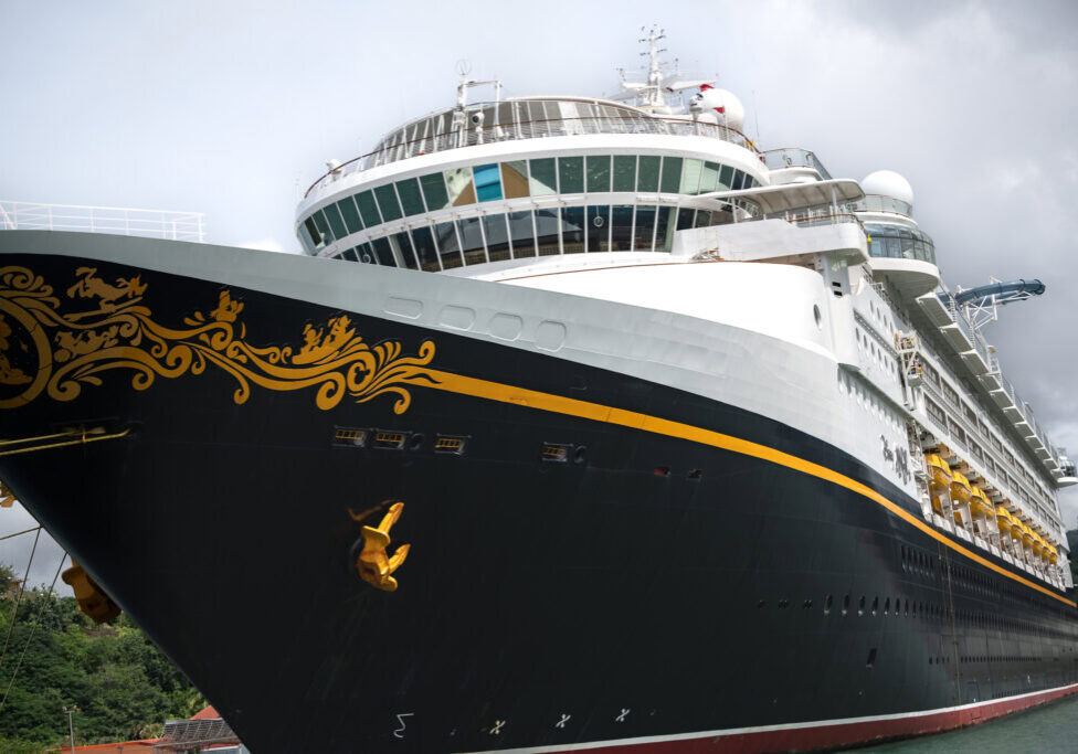 Close-up of the Disney Magic cruise ship docked in St. Lucia, photographed from a catamaran during a Southern Caribbean itinerary.