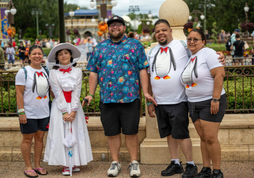 Family photo with Daniela dressed as Mary Poppins and Disney content creator Paging Mr. Morrow.