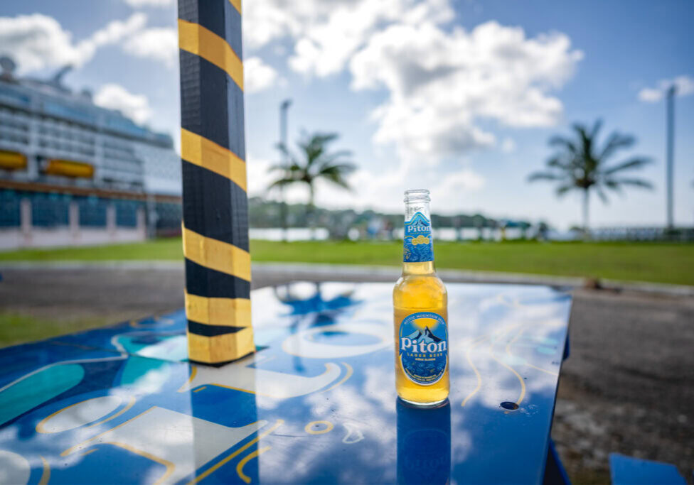 Piton beer enjoyed near the St. Lucia cruise port with Disney Magic in the background
