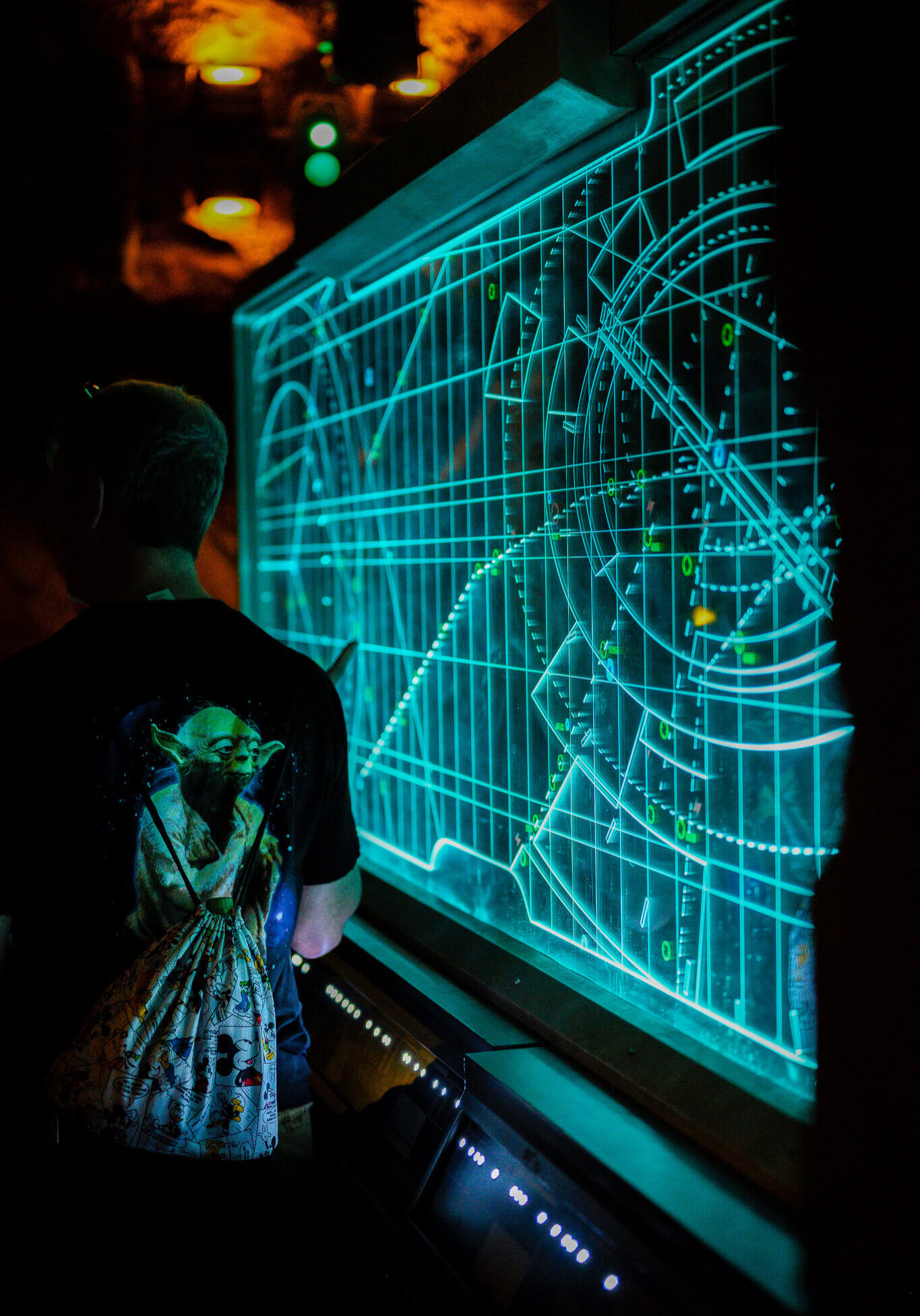 Guests viewing a Resistance tactical display in the queue for Star Wars: Rise of the Resistance at Disney's Hollywood Studios.