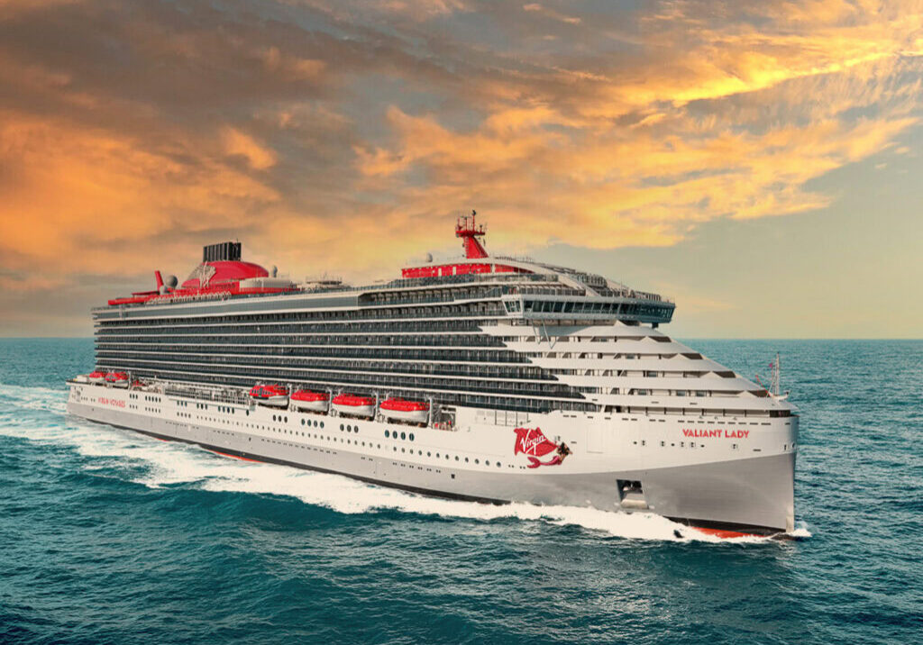 Virgin Voyages Valiant Lady cruise ship at sea during sunset